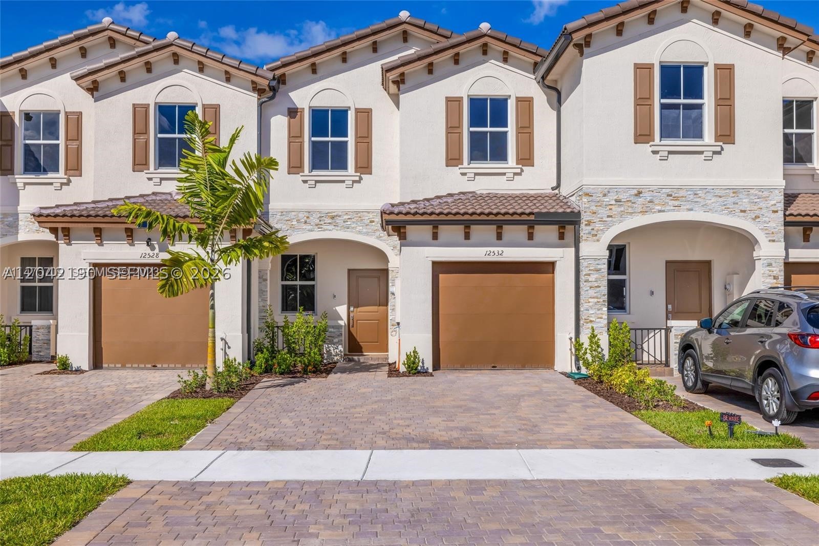 Exceptional investment opportunity! Built in 2023, this like-new 3-bedroom, 2.5-bathroom townhouse offers modern living in a highly desirable gated community in the heart of Miami. Featuring an open-concept layout, quartz kitchen countertops, stainless steel appliances, tile flooring on the first level, carpet on the second floor, abundant natural light, a spacious backyard, and a one-car garage. Residents enjoy access to outstanding community amenities, including a clubhouse, fitness center, dog park, playground, and beautifully maintained common areas. The location is unbeatable, with easy access to major expressways and just minutes from shopping, dining, schools, and entertainment. Conveniently located approximately 15 minutes from Miami International Airport, 30 minutes from Brickell and Downtown Miami, and about 25-30 minutes from South Florida's beautiful beaches. Investor only opportunity. The property is currently leased through June 2027, providing immediate rental income and long-term stability. An excellent option for investors seeking a turnkey asset in a growing Miami market with strong rental demand and attractive appreciation potential. Modern construction, prime location, secured community, and built-in income—this is the investment opportunity you've been waiting for.