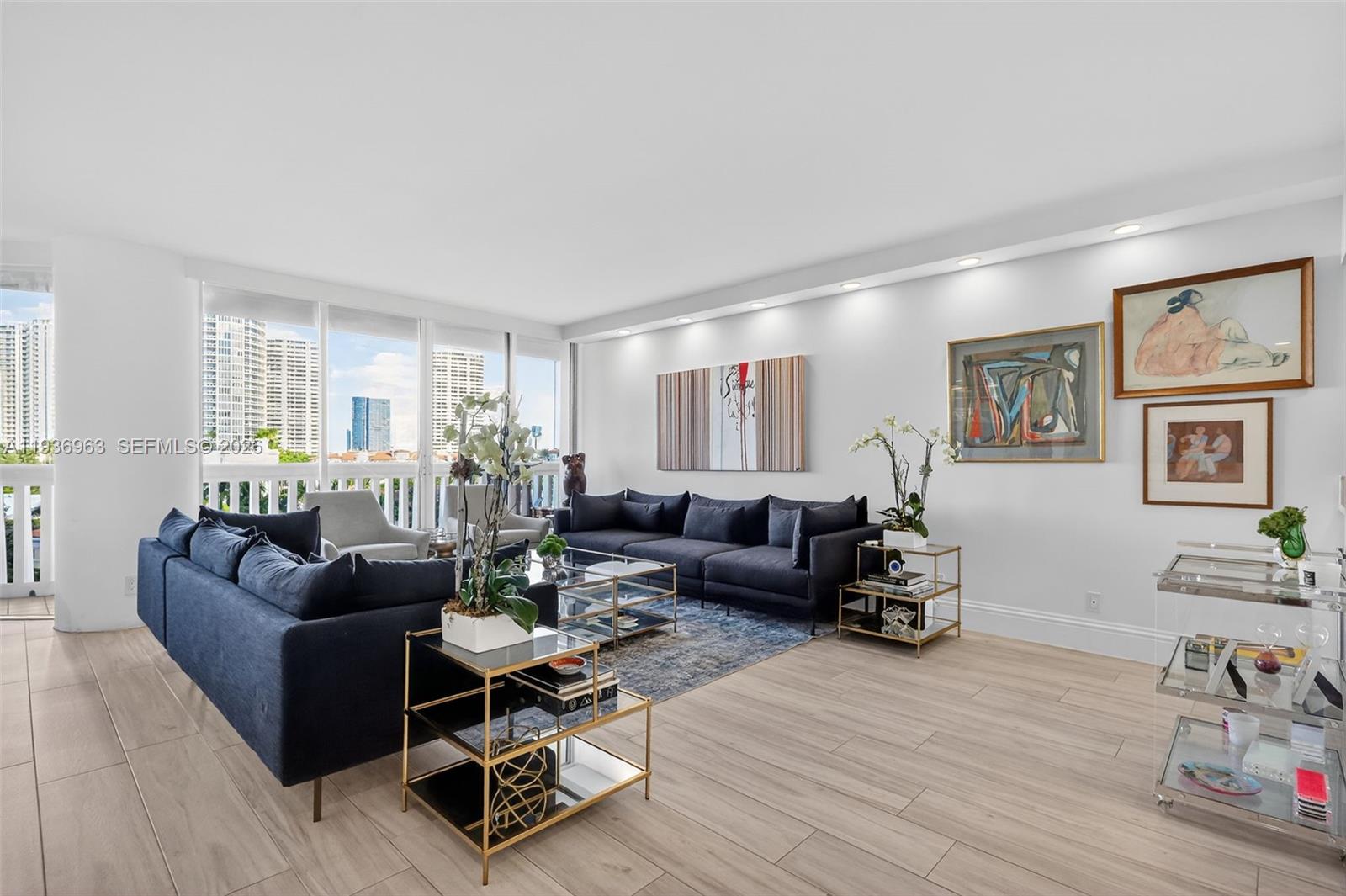 Beautifully fully renovated flow-through residence offering 1,696 square feet of refined living with sunrise and sunset views. This thoughtfully redesigned home features an open-concept kitchen with expansive quartz countertop workspace, ideal for both everyday living and entertaining. Porcelain flooring throughout, LED lighting, and custom built-out closet systems elevate the space with a modern, cohesive design. The residence includes a convenient guest half bath, an independent laundry room, and seamless indoor living with east views overlooking Island Gardens and west-southwest vistas spanning the Intracoastal and Maule Lake—providing breathtaking natural light throughout the day.
Enjoy the Williams Island lifestyle, a magnificent gated community offering world-class amenities, including a full social calendar, 14 TENNIS COURTS, 4 PICKLE BALL COURTS, 2 PADEL COURTS, 3 RESTAURANTS, STATE OF THE ART SPA, MARINA, WALK/JOG PATH, KIDS PLAYGROUND, BASKETBALL COURT, SOCCER FIELD, PUTTING GREEN, COURTESY BUS, PLUS GOURMET SUNDRY COFFEE/GELATO SHOP, AND SO MUCH MORE....A rare opportunity to own a turnkey residence in one of South Florida’s most prestigious communities.