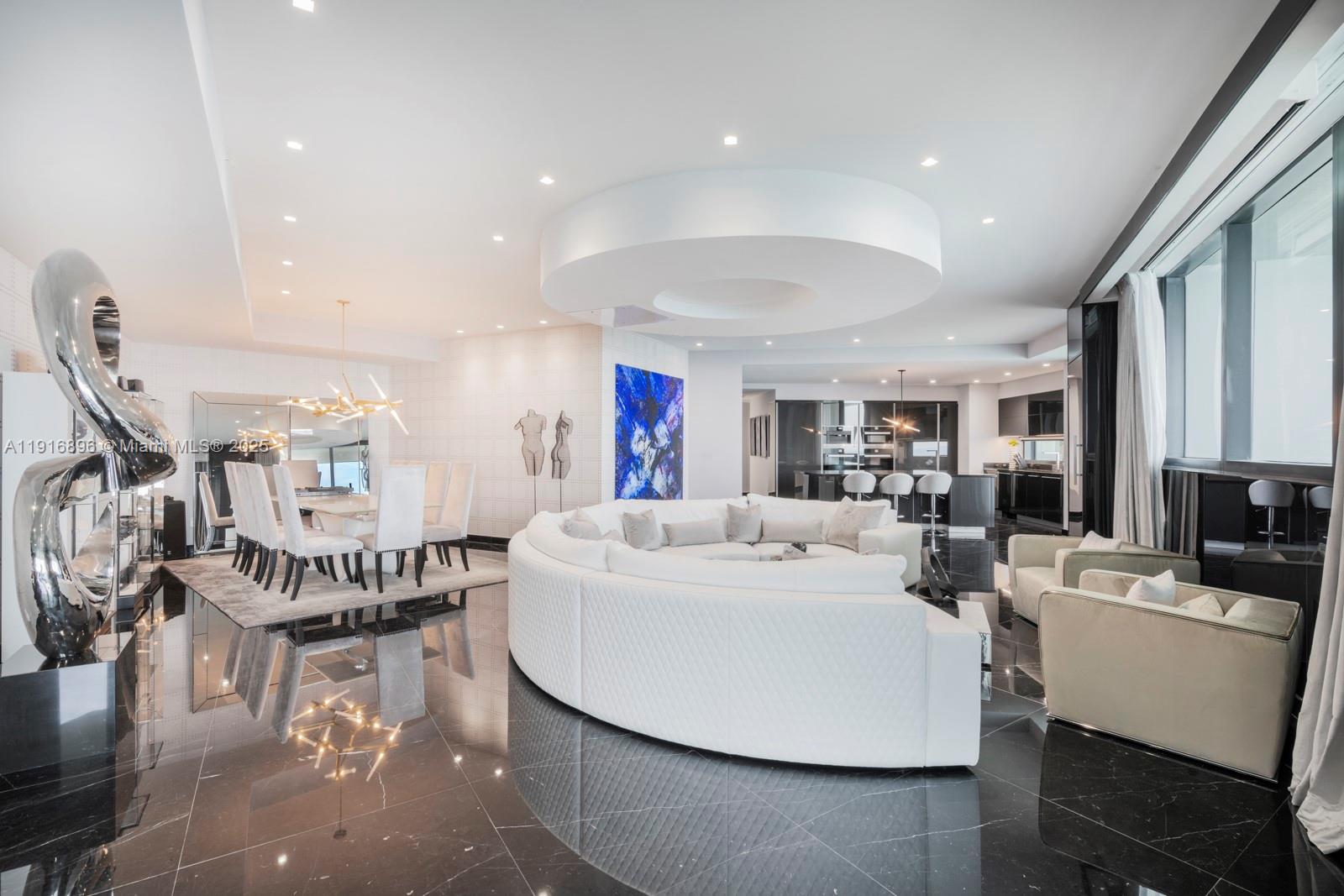 Experience an elevated standard of oceanfront living in this spectacular 4-bedroom mansion in the sky at the iconic Porsche Design Tower. Perched on the 35th floor, this residence offers the best unobstructed Atlantic views in the entire building, framed by floor-to-ceiling glass in every room.
Drive directly into your private 2-car sky garage and enter a world of refined sophistication. The home showcases mirror-polished marble floors, custom textured wall treatments, designer lighting, sleek high-gloss finishes, and meticulous craftsmanship throughout. The Poggenpohl kitchen with Miele appliances is a showpiece of modern design, seamlessly blending style and performance.
Step onto your expansive oceanfront terrace featuring a private balcony pool and summer kitchen — the ultimate sanctuary for relaxation and indoor-outdoor living.
This exclusive tower offers unmatched amenities including room service, private chef, full restaurant & bar, spa, fitness center, car concierge, and premier security — redefining luxury at every level.
A residence where every detail is curated to surpass even the highest expectations.