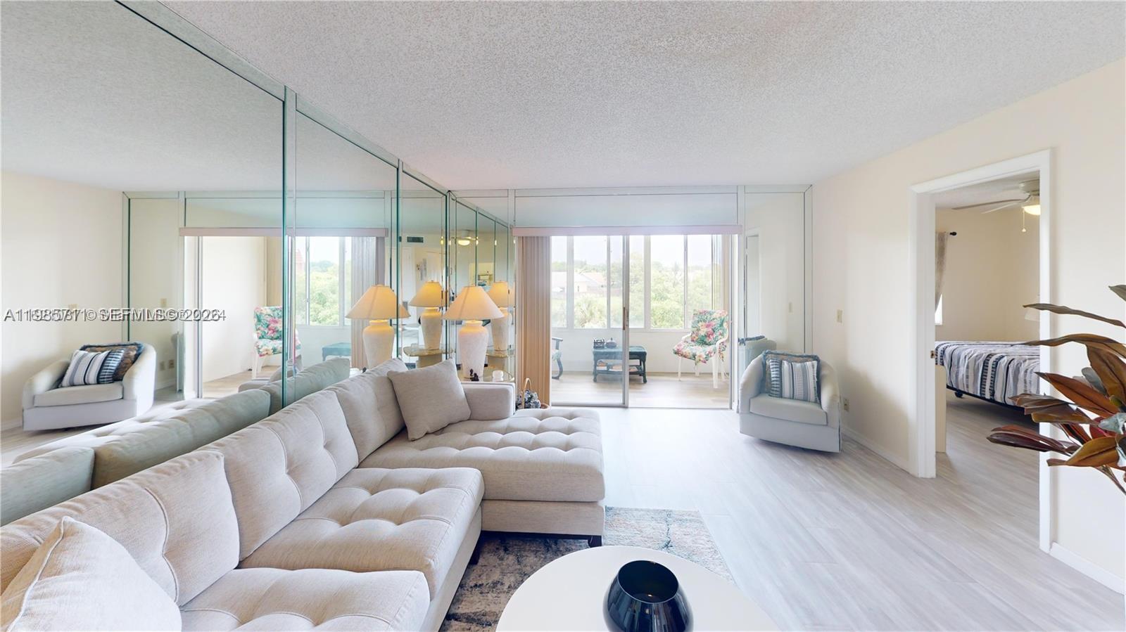 Don't miss your chance to own this furnished, turnkey, top floor condo features all new waterproof luxury vinyl laminate flooring, new living room and dining room furniture as well as new mattresses. NEWER A/C 2019 keeps the unit nice and cold on hot summer days. The building has a NEW ROOF and ALL ASSESSMENTS PAID BY SELLER! Sunrise Lakes Phase 3 also offers amazing amenities including 10 swimming pools, gym, free golf, tennis, pickleball, racquetball, dances, movies, bingo and so much more! This unit is vacant and easy to show. Maintenance includes, WIFI, cable, pest control, security guards, reserves, etc. Look for the Matterport virtual tour to view in detail!