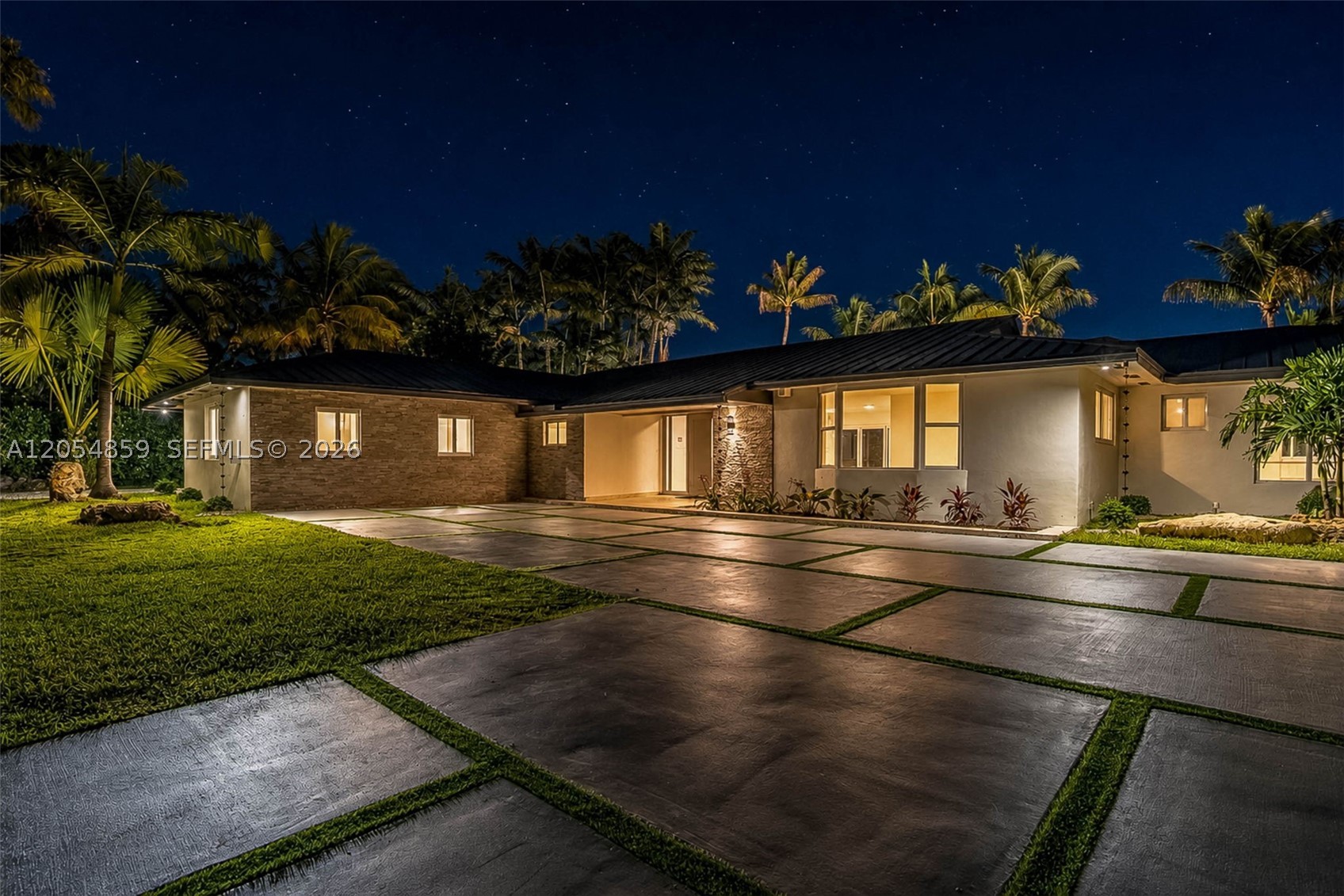 Beautifully reimagined & updated sprawling 6 bedroom/ 3 bath home in the heart of Palmetto Bay. Generously sized open concept living & dining. Modern kitchen with center island, counter seating, gas cooktop & pantry. Split bedroom floor plan with in-laws/ junior suite + 3 guest bedrooms on one wing. Separate primary suite complete with stunning, spa-like bath, spacious custom walk-in closet & exclusive access to a private lanai with jetted plunge pool. Adjacent bedroom perfect for an office. New porcelain tile flooring, impact windows/doors, metal roof. Indoor laundry. Fabulous outdoor space; covered patio with electric screens, pool with sun shelf, exterior lighting. Fenced backyard with double gate and gravel drive to park the boat. Architectural paver driveway. A+ schools.