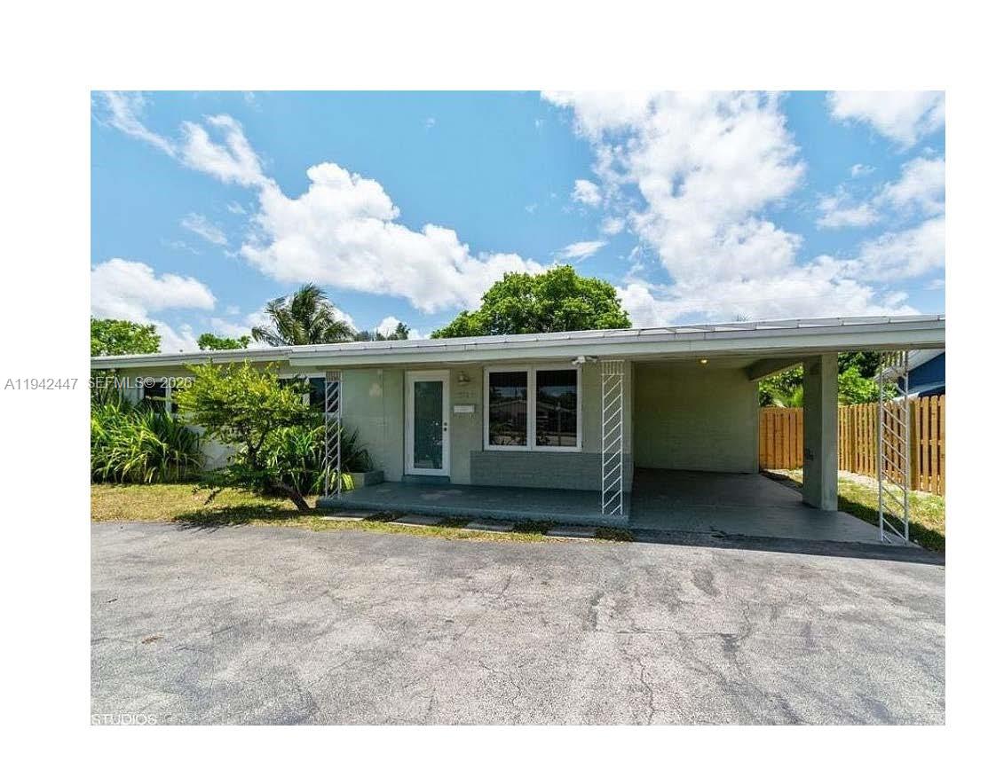 Priced to Sell. Designed for effortless Florida living, this move-in-ready residence offers an exceptional blend of style, durability, and convenience. Ideally located just minutes from Wilton Drive, I-95, area beaches, and local dining, the home has been thoughtfully upgraded to meet today’s standards.

Features include a metal roof, full impact windows and doors, PVC plumbing to the street, a newer A/C system, updated appliances, spacious bedrooms, smart home features, and a light-filled sunroom.

Outdoor living is equally impressive, with a sunlit, fully fenced, low-maintenance yard featuring mature landscaping, a private putting green, and a deck ideal for outdoor dining and entertaining. A refreshed driveway and carport complete this well-maintained property.

An excellent opportunity for both owner-occupants and investors. Schedule your showing today.