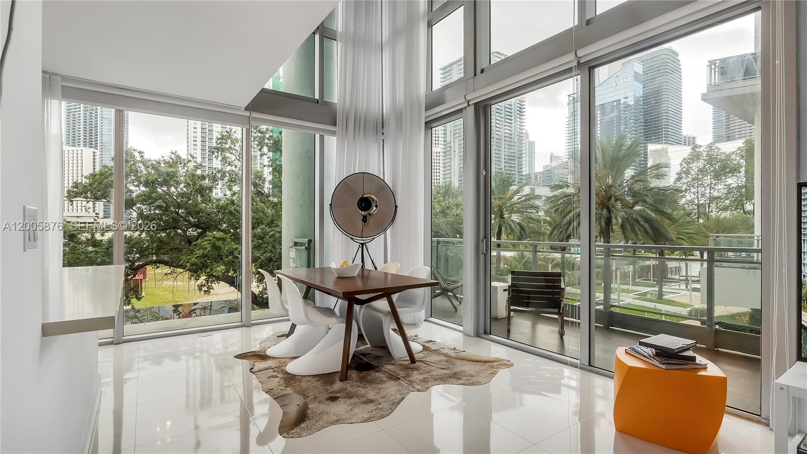 One of a kind corner unit 2 bed + Den two story townhome at the Ivy at Riverfront Condominium. Floor to ceiling windows and soaring ceilings offer breathtaking views of the Miami River and Brickell Skyline. Open concept kitchen, storage unit, and 2 assigned tandem parking spaces conveniently located on the same floor.  Enjoy resort style living in a gated community with 24-hr security, state of the art fitness center, spa, infinity pool, business center, supermarket and more. Easy to show. Don't miss this exceptional opportunity!