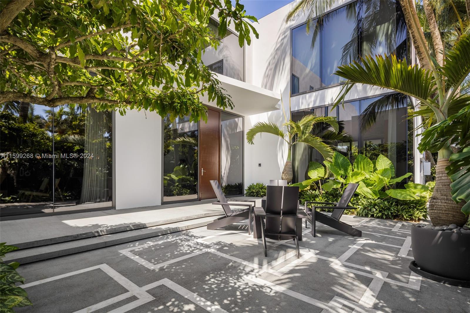 Stunning architecturally significant custom home for sale on much sought after Meridian Ave in south beach. Sweeping golf course views and situated walking distance to the beach, sunset harbor, Lincoln road, the Ghery performing arts center, the convention center and city hall. Restaurants, shops, hotels, schools, houses of worship all at your fingertips. 
6 bedrooms 6 1/2 bathrooms. Master suite on the main floor.
Large expansive living room/dining room/kitchen with walls of glass that open to your tropical garden oasis.
2 more relaxing studies, one on the main floor and one on the second floor.
Entry foyer with spiral wood/metal staircase and double sided fireplace with quartzite surround.
Custom plaster ceilings throughout the main floor. 2 laundry rooms, generator, full automation
