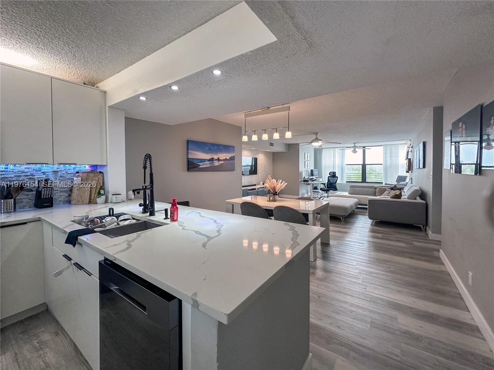 Welcome Home, Incredible opportunity to own a substantially remodeled 4th-floor condo located in the highly desirable Township community in Coconut Creek. This bright and beautifully updated unit features an open-concept living and dining area filled with natural light showcasing a breathtaking lake view. Enjoy tranquil, panoramic water vistas and stunning sunsets—perfect for relaxing mornings or peaceful evenings at home. The kitchen offers ample cabinetry and counter space, ideal for everyday living. The primary suite includes a generous walk-in closet and private bath. The second bedroom provides flexibility for guests, office, or additional living space.
Washer and dryer hook up, plenty of storage, and assigned parking. Enjoy resort-style amenities including clubhouse, pool, fitness center, tennis courts, walking paths, and more. Conveniently located near shopping, dining, major highways, and all that Broward County has to offer.
