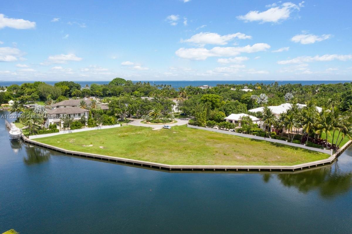 World renowned Gables Estates 1+ acre, prime waterfront lot now available for building your dream home. Located at the end of the cul-du-sac on Leucadendra Drive, this property boasts 400 linear feet of water frontage, is clear of trees and has no fixed bridges to the open bay (which is seconds away). Gables Estates is a gated enclave just south of Miami that is unparalleled in the area. One Leucadendra Drive is the only vacant land with this much water frontage in the community available for sale. Call to schedule your viewing of this magnificent property.