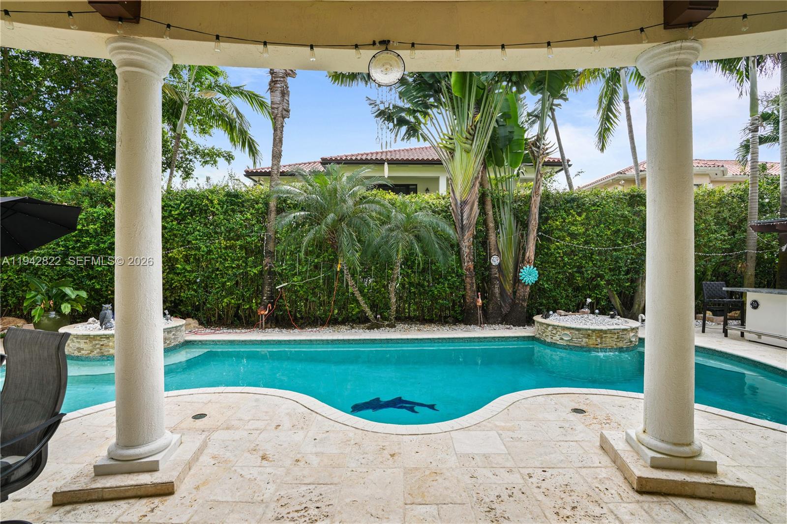 Gorgeous 5-bedroom, 4-bath residence located in the exclusive gated community of Cutler Cay. Offering over 4,700 sq ft of elegant living space, this home features soaring ceilings, marble floors, and a gourmet chef’s kitchen, which is appointed with new stainless steel appliances and ample cabinetry. Custom-made front door. Spacious family room that opens seamlessly to the pool, complete with a heated saltwater system. The fenced patio boasts a fully equipped outdoor kitchen, perfect for entertaining or relaxing in privacy. The expansive primary suite includes dual walk-in closets, his-and-hers showers, and double vanities. Residents enjoy resort-style living with access to a spectacular clubhouse featuring a gym, sauna, steam room, pool, tennis and basketball courts, and 24/7 security. The HOA fee includes alarm service, internet, cable, and front yard maintenance.