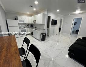 Investor's Dream! Prime location meets incredible value. 2-bedroom units! This non-conforming multi-family gem is the perfect addition to your portfolio. Here are the highlights: All four units are already rented, ensuring immediate returns on your investment. Washer/dryer units are installed in each apartment, central AC, and new finished throughout. This property is a completely turnkey investment opportunity!