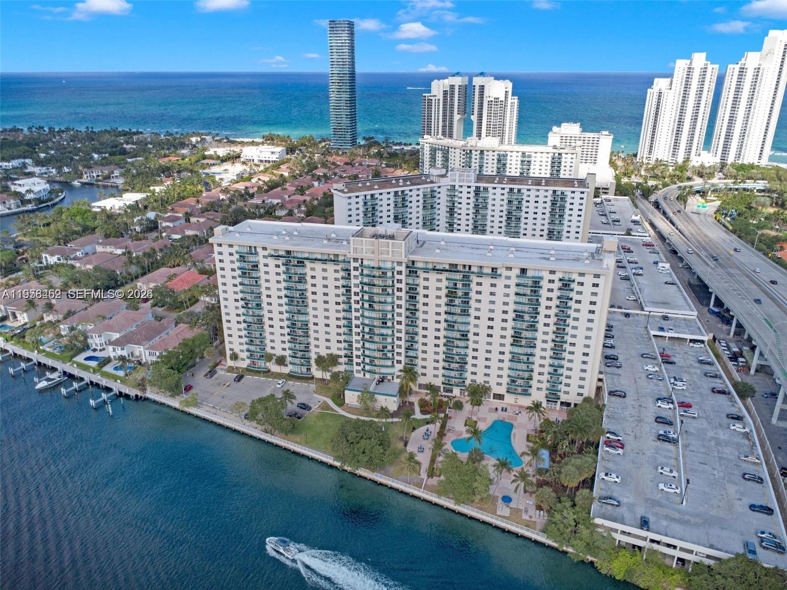 ***GREAT OPPORTUNITY*** 2-bedroom, 2-bath unfurnished residence in Ocean View Building A, a waterfront community ideally located in the heart of Sunny Isles, just one block from the beach. This well-designed unit offers generously sized bedrooms, two tastefully updated bathrooms, expansive closet space, and a modernized kitchen featuring solid wood countertops. Tile flooring runs throughout, and a large private balcony provides an excellent space to relax and enjoy the surroundings. Smart home upgrades include a smart entry door lock. One assigned garage parking space is included. HOA covers water, WiFi, TV, and 70% of the electricity used for A/C, delivering outstanding value. Ocean View Building A boasts resort-style amenities such as a heated waterfront pool, social deck with new lounge furniture and BBQ areas, on-site coffee shop, and a fully equipped fitness center. Conveniently located within walking distance to Publix, shopping, and dining, plus complimentary shuttle service to Aventura Mall. Just 5 minutes to Aventura Mall and approximately 15 miles to both Fort Lauderdale and Miami.