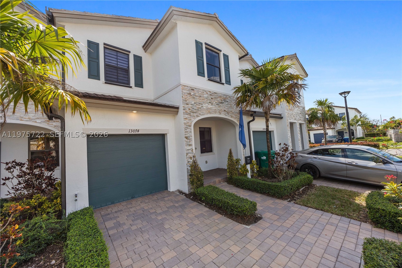 South Florida living at its best! This former builder model has never been lived in and is perfect as a starter home, second home, or investment. The 3BR/2.5BA layout offers modern comfort with a sleek kitchen featuring stainless steel appliances, a fenced rear yard, and a spacious primary bath with walk-in shower. Furniture not included but negotiable. Enjoy affordable HOA fees and great amenities including a clubhouse, fitness center, pool, and tot lot. Square footage approximate.