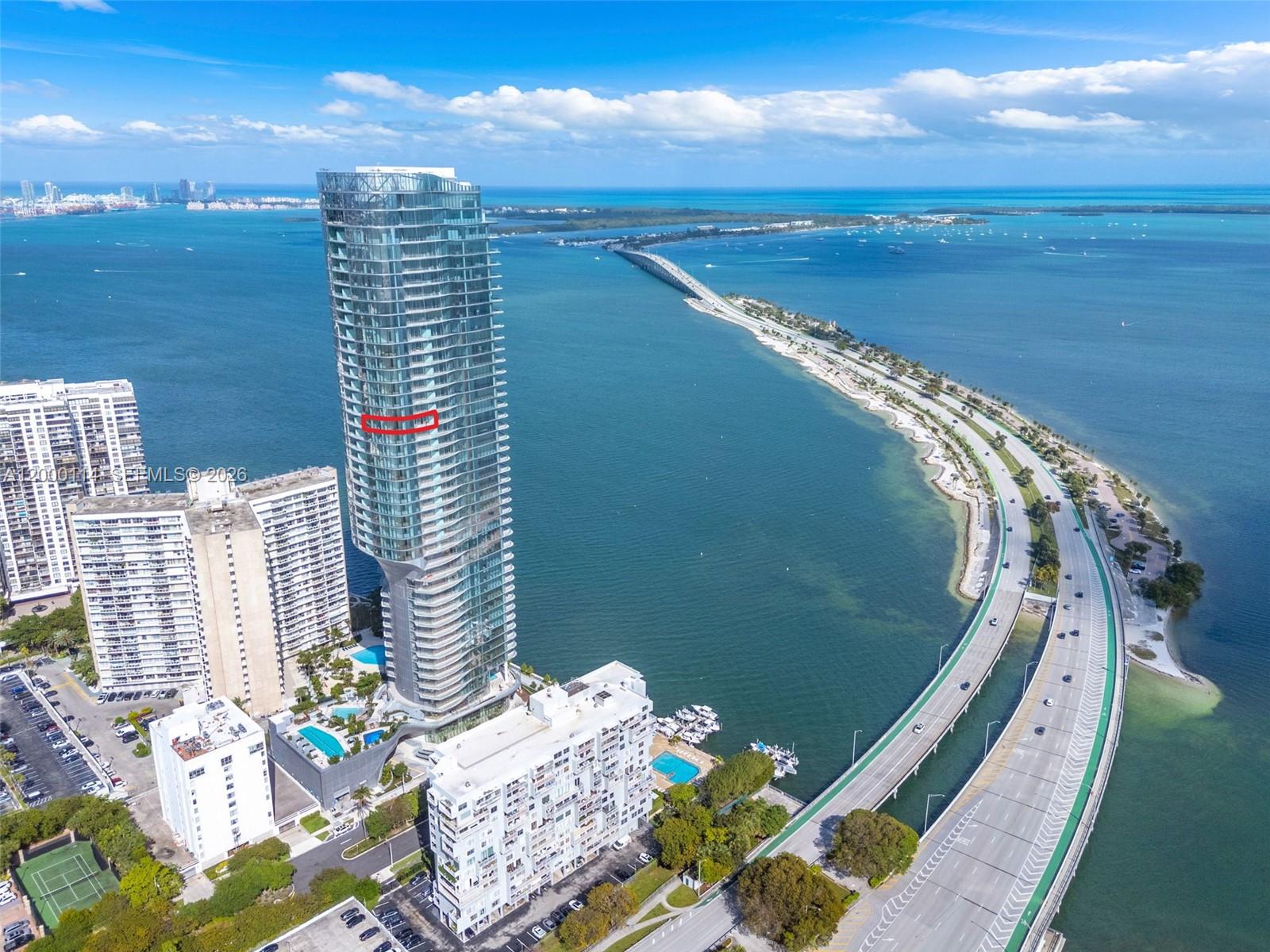 Welcome to UNA - the only new construction building in South Brickell. Soaring high above the bay and with truly one of a kind stunning, expansive views, this brand-new, never-lived-in residence at UNA embodies a rare level of sophistication and exclusivity. #3003 offers 3 bedrooms, 3 bathrooms, plus a powder room across 2,250+ total square feet, complemented by two private terraces. Designed to maximize light, openness, and breathtaking water and skyline views, the residence features floor-to-ceiling glass and seamless indoor-outdoor living. The flow-through layout is both refined and functional, with a sleek designer kitchen, premium finishes, and living spaces curated for a modern luxury lifestyle. Every element of this home reflects elevated living - from its luminous interiors to its commanding vantage point within one of Miami’s most architecturally celebrated waterfront towers. UNA Residences delivers a world-class lifestyle with resort-style amenities, including bayfront pools, spa, fitness center, and absolute white glove service. A distinguished offering for buyers seeking a higher caliber residence in a brand-new, design-forward development