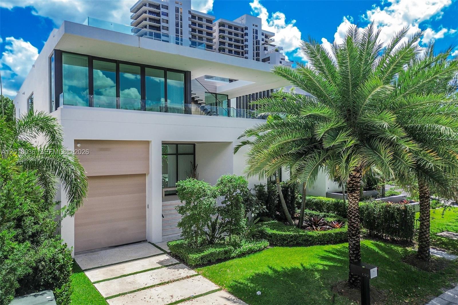 Discover elevated luxury living in the heart of the exclusive Venetian Islands. Tucked away on a quiet cul-de-sac, this exceptional 4-bedroom / 4.5-bathroom contemporary residence showcases sophisticated modern design, premium finishes, and effortless indoor-outdoor living. Thoughtfully designed for both comfort and entertaining, the home features a stunning Italian chef’s kitchen equipped with top-of-the-line appliances, sleek custom cabinetry, and designer built-ins throughout. Expansive living spaces are filled with natural light, creating a seamless blend of elegance and warmth. The private 2-car garage plus a car lift for added convenience and luxury. Above it all, the expansive rooftop terrace offers breathtaking 360-degree views of Biscayne Bay and the Miami skyline — an unforgettable setting for entertaining, sunset gatherings, or quiet relaxation. Ideally located just minutes from Miami’s world-renowned beaches, Sunset Harbor, Edgewater, and the Design District, this residence offers the perfect balance of privacy, sophistication, and access to the city’s best dining, shopping, and nightlife.