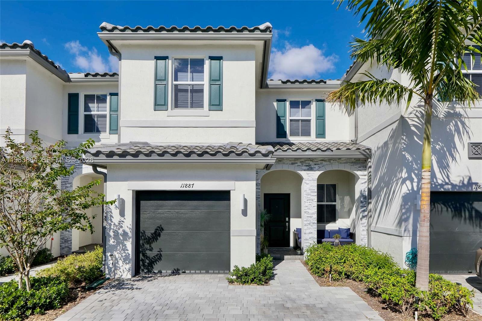 Two-story modern townhome has a smart layout that makes great use of all the available space. Most popular floor plan! The front door leads into an open concept living room, which flows into the dining room, kitchen and separate family room area. Modern "Italian style" kitchen with picture window above the sink allows for plenty of natural light. Upstairs, two secondary bedrooms feature walk-in closets and a small loft area that is a nice spot for a small desk. The owner’s suite is tucked into the back with a
huge walk-in closet and private bathroom. Modern bathroom features dual-sinks, ample vanity area and storage.  Fenced backyard for entertaining. Home features Ring doorbell, smart-home features and has complete hurricane impact protection.