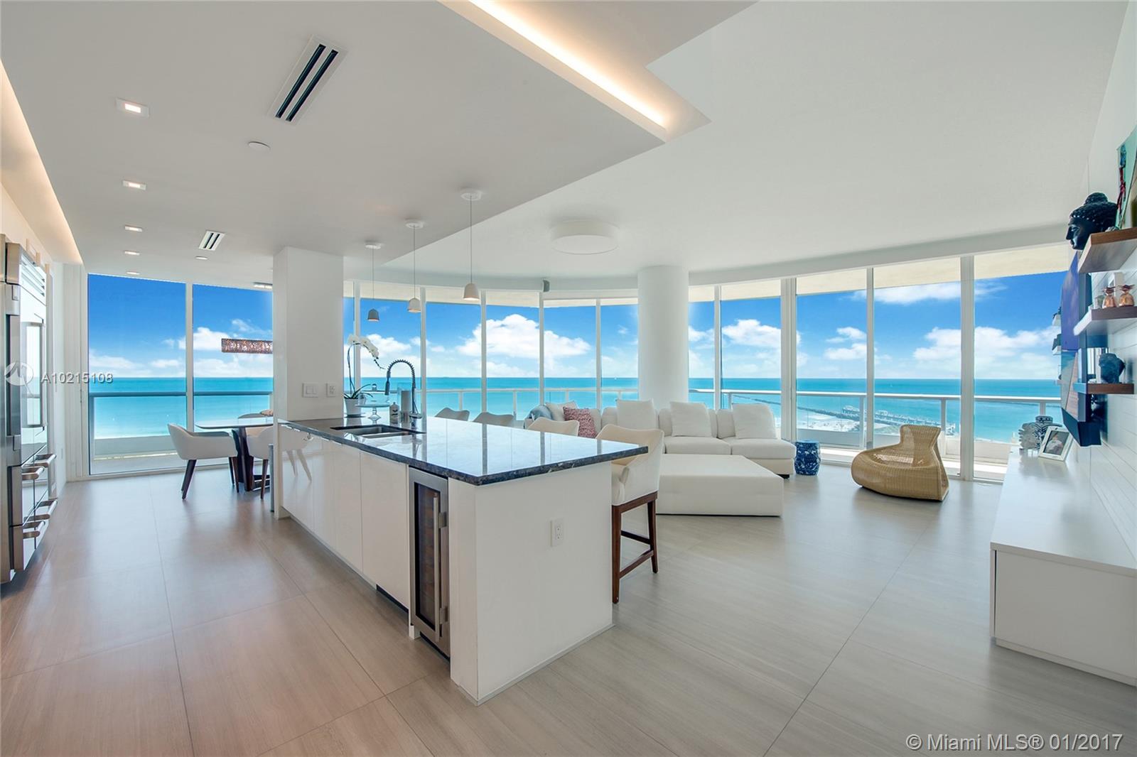 Rare & most sought after rotunda SE corner has a completely redesigned open  floor plan with impressive views through its wall to wall, floor to ceiling glass  with soaring 9'10" height.  $1M in luxe upgrades include a brand new chef's gourmet kitchen featuring Gaggenau induction cook-top, SubZero glass refrigerator, freezer and cava storage, state-of-art media, 36' marble, custom lighting & motorized window treatments. A lavish 716sf wrap terrace commands pristine beach, South Pointe Park, parading cruise ships and Fisher Island views. Three levels of security, bio-metric entry, private lobby, professional concierge, private restaurant, 18k Sq.ft. Gym/Spa, 3 clay Tennis Courts  and a Private Beach Club all awaits you on 12.5 acre beachfront oasis in the very best location.