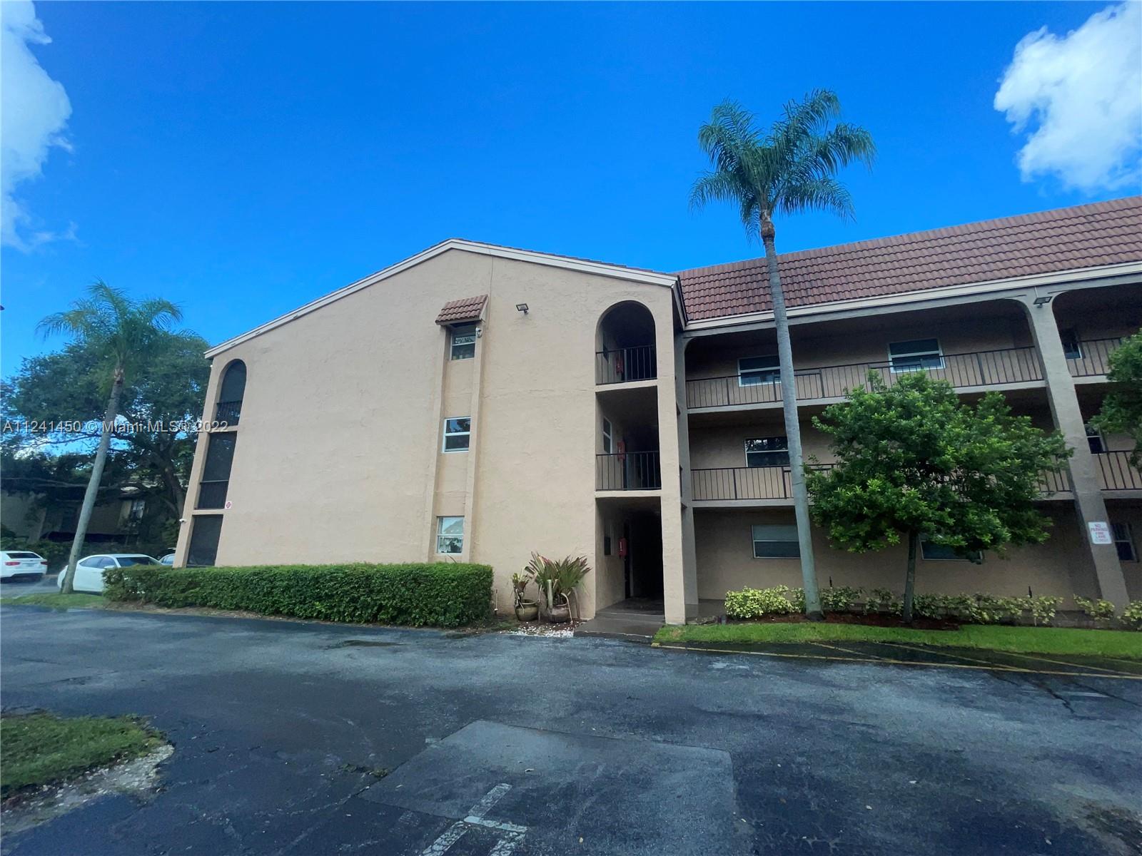 Gorgeous 2/2 FIRST floor corner with Hugh open living space, beautiful kitchen with wood cabinets, tile floors through out, new A/C unit and washer dryer, screened porch lots of closet space and much more. This beautiful unit is situated in a well maintained community with swimming pool and an elevator, few minutes from down town Coral Springs, A+ rated schools in the county.