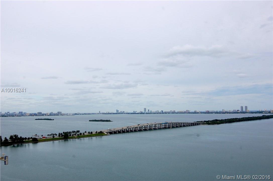 Loft stlye 1/1.5 with 2 large private balconies. Granite kitchen, stainless appliances, wood floors, and marble bath. Comes with Garage parking and Free Cable. Building amenities include gym, pool, jacuzzi, steam rooms and doorman. Gorgeous views of Biscayne Bay. FURNISHED unit in the center of vibrant Mid town located 15 minutes from Miami Beach.  24 hour concierge, security, parking garage, pool, BBQ area & gym.  DO NOT MISS THIS OPPORTUNITY. Will not last.