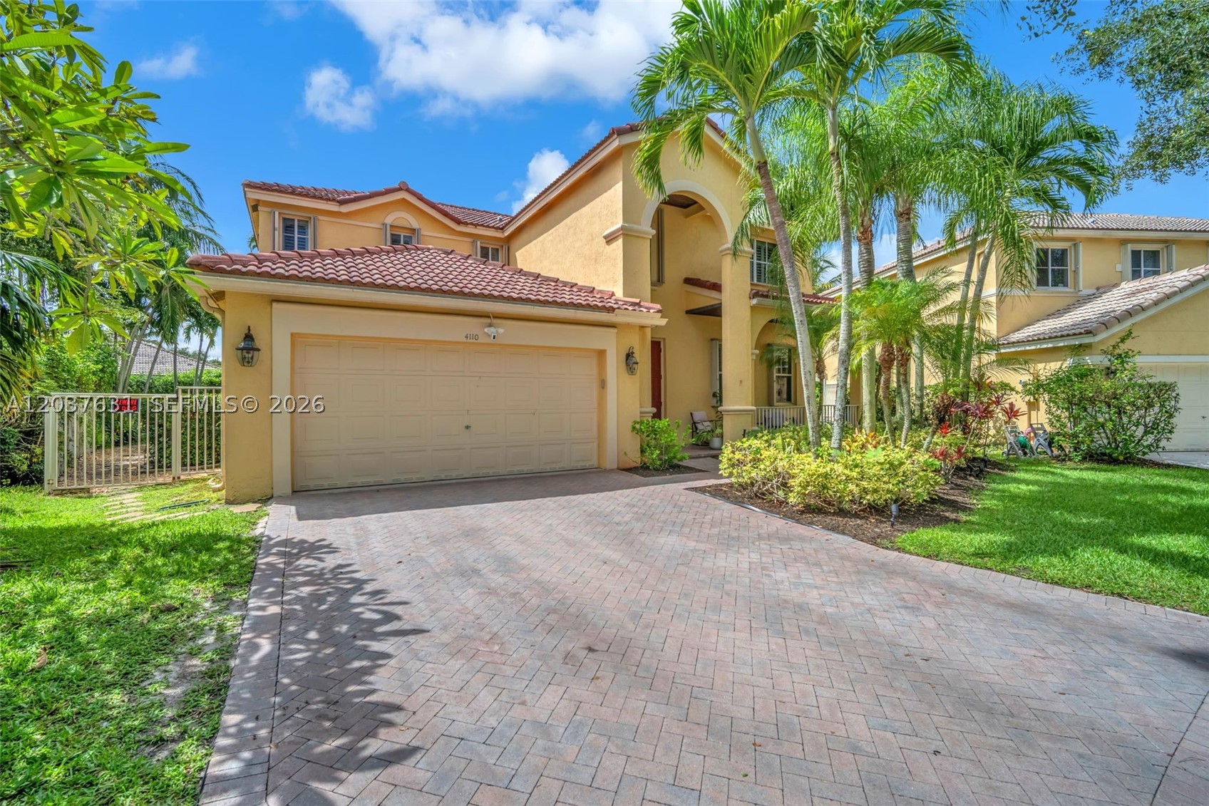 Experience refined South Florida living in this beautifully appointed 4-bedroom + loft (convertible to a 5th bedroom), 3-bath pool home. A grand entry with soaring volume ceilings opens to elegant formal living and dining rooms, while neutral designer finishes, tile and wood-look flooring, and a spacious family room create an inviting atmosphere for everyday living and entertaining. The remodeled gourmet kitchen features 42-inch wood cabinetry, quartz countertops, stainless-steel appliances, a breakfast bar, and a walk-in pantry. A first-floor bedroom, full bath, and laundry room with washer and dryer offer flexibility for guests or multigenerational living. Upstairs, the luxurious primary suite boasts custom walk-in closets and a spa-inspired bath with dual vanities, a soaking tub, frameless glass shower, and porcelain tile. All secondary bedrooms include custom built-in closets. Step outside to your private oasis featuring a screened, heated saltwater pool, covered patio, lush landscaping, and a fully fenced backyard. Additional highlights include newer dual-zone A/C systems and accordion hurricane shutters. Located in a prestigious 24-hour manned gated community with a clubhouse, resort-style pool, children's splash pad, playground, BBQ pavilion, tiki huts, sports fields, and more. AAA schools' zone.