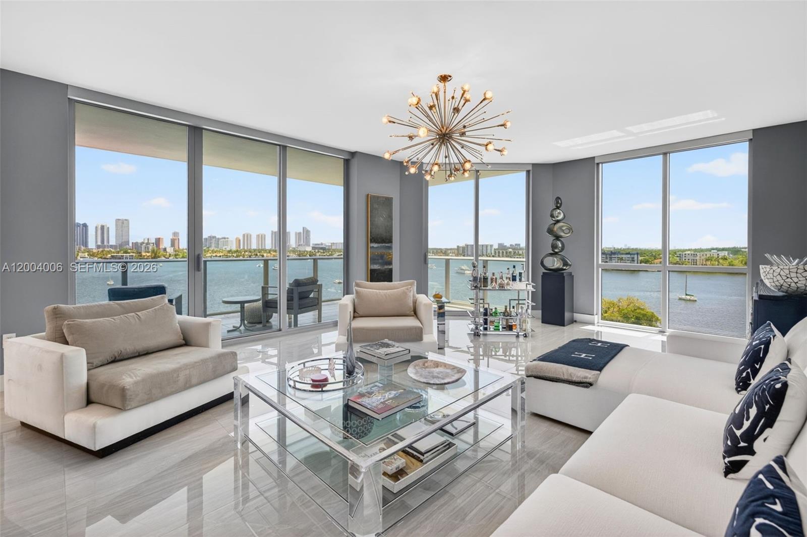 THE MOST SOUGHT AFTER AND DESIRABLE FLOOR PLAN IN THE MARINA PALMS RESERVE BUILDING. THE “PERFECT 10” SOUTHEAST CORNER RESIDENCE WITH 3BR/3.5BA + DEN HAS GORGEOUS PORCELAIN FLOORING AND CUSTOMIZED CLOSETS THROUGHOUT. UNOBSTRUCTED BREATHTAKING INTRACOASTAL AND BAY VIEWS FROM THE  WRAPAROUND BALCONY. ONE OF THE RARE LAYOUTS FEATURING A SEPARATE DEN THAT CAN ALSO BE USED AS AN ADDITIONAL WALK IN CLOSET.
THIS EXCEPTIONAL HOME OFFERS AN OPEN KITCHEN WITH ISLAND AND BREAKFAST NOOK, EXPANDED SNAIDERO CABINETRY, CUSTOM BACKSPLASH AND PREMIUM WOLF AND SUB-ZERO APPLIANCES. SPACIOUS PRIMARY SUITE HAS AN OVERSIZED WALK-IN CLOSET AND LUXURIOUS SPA-STYLE BATH. ALL BEDROOMS ARE GENEROUSLY SIZED WITH EN-SUITE BATHROOMS AND PROVIDE COMFORT AND FLEXIBILITY. UNIT COMES WITH *****TWO PARKING SPACES PLUS STORAGE**** RESORT-STYLE AMENITIES INCLUDE A POOL WITH TOWEL SERVICE, OUTDOOR KITCHEN, ATTENDED SPA & FITNESS CENTER, SAUNA/STEAM ROOMS, SPINNING STUDIO, NEWS CAFE, BUSINESS CENTER WITH CONFERENCE ROOM, BILLIARDS & COMMUNITY ROOMS, KIDS & TEEN ROOMS, PARK & DOG PARK.*** PET FRIENDLY BUILDING***

MARINA SLIP AVAILABLE FOR SALE - SLIP #78 - 70 FOOT SLIP. - MLS A11982473