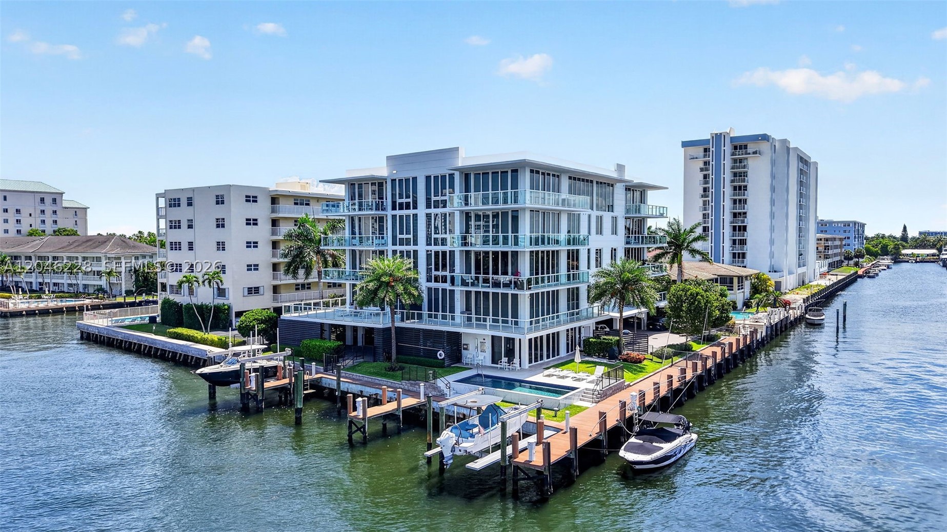 A Rare Opportunity to own this 'one-of-a-kind',  Luxury Waterefront Condominium  in 'Coral Ridge'.  Located directly on the Intracoastal this corner-point unit features panoramic N/E wrap-around views. *BONUS:  FULLY FURNISHED, TURN-KEY* Move right-in!.  Like brand-new. Seldom occupied.  Quick-closing available.  Designer-built, 3-BR, 3.5BA 2126/sf + 634/sf balcony.  Features include: Direct elevator-access, 2-Car prkg.+ avail. guest parking & Yacht-Dockage for up to 60'+/-  This building boasts 250' of water frontage and no fixed bridge access to the Atlantic Ocean.  Near Fort Lauderdal Beach, upscale shopping, Dining & Bakeries & prestigious and 'Coral Ridge Country Club,' for Golfers.

The 1st floor provides designated parking, building lobby & owners' club room & gym.  The 2nd, 3rd & 4th  floors consist of only 3-residences per floor and 2-penthouses on the 5th floor.  Only 11-total units.  This like-new unit features 10' ceilings, Top of the line appliances, European custom cabinetry, wired smart technology, high impact windows, two parking spaces, large storage room on same floor, add'l.  guest parking , patio/garden BBQ heated pool & more.  The design, layout and custom features will satisfy the most-discriminating buyers.  Private scheduled viewing appts. only  *(Use Showing Time).
