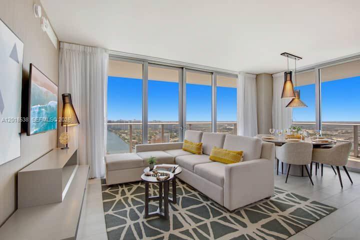 Corner unit with panoramic ocean, intracoastal and skyline views. Beautiful 3 bedroom 2.5 bathroom. Fully furnished. Five star resort-style amenities with full concierge service, access to oceanfront private beach club, three heated oversized pools, cabanas, spa, state of the art gym, rooftop lounge & common are with BBQ, tennis court, racquetball, high speed internet in all public areas, 24 hrs security, free valet parking. Maintenance includes electricity, cable, internet & water. The perfect vacation home and/or your income producing property. Unit management by Stay Sol. NO RENTAL RESTRICTIONS !!!