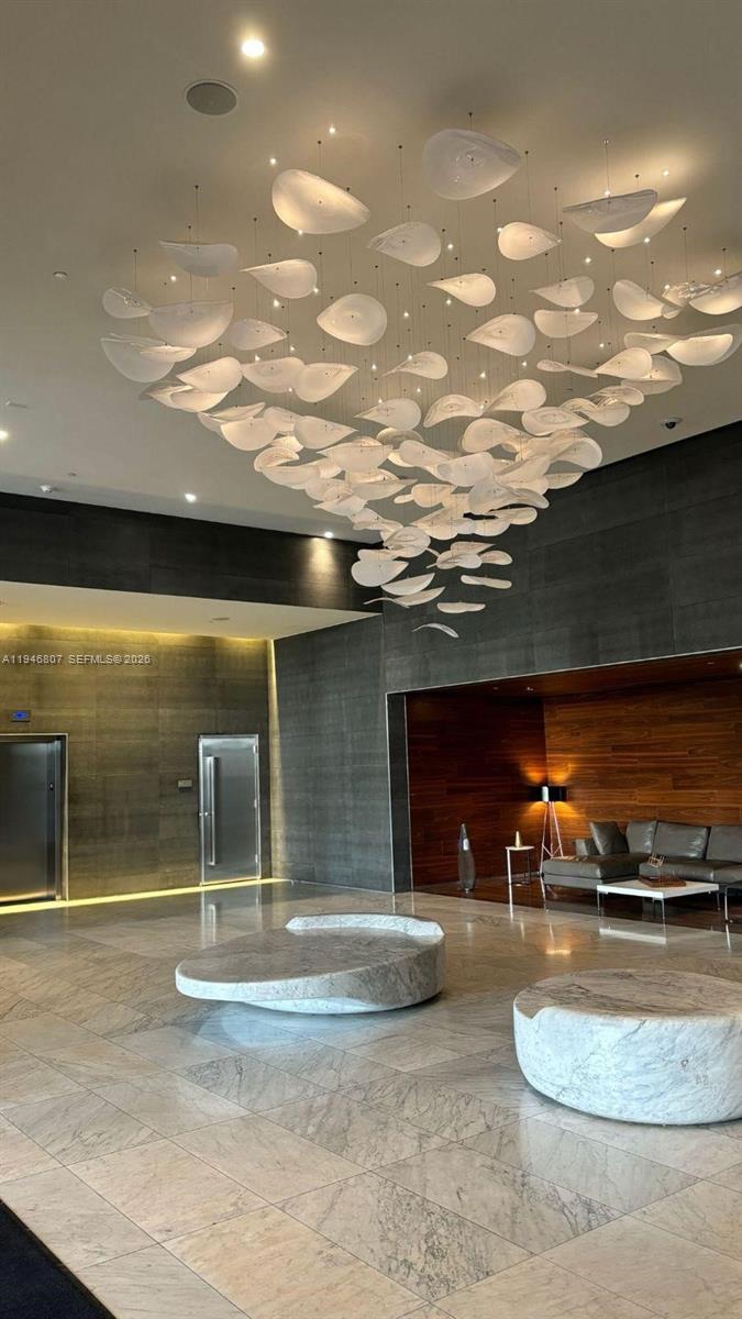 Experience luxury living in this modern 3-bedroom, 3.5-bathroom residence at REACH Brickell City Centre, designed by Arquitectonica. Located on the 25th floor, the unit offers breathtaking water and city views and features luxurious finishes, numerous upgrades, and an additional den that can be used as a TV room or office. Residents enjoy nearly one acre of upscale amenities, including heated pools, fitness center, BBQ grills, family-friendly spaces, spa and salon, concierge services, and more. The unit includes assigned covered parking P6-276 plus one valet parking space, with basic cable and internet included in the HOA fee. Ideally located at the heart of Brickell, this move-in-ready residence offers a truly connected and privileged lifestyle. To schedule a showing, please call or text the listing agent.