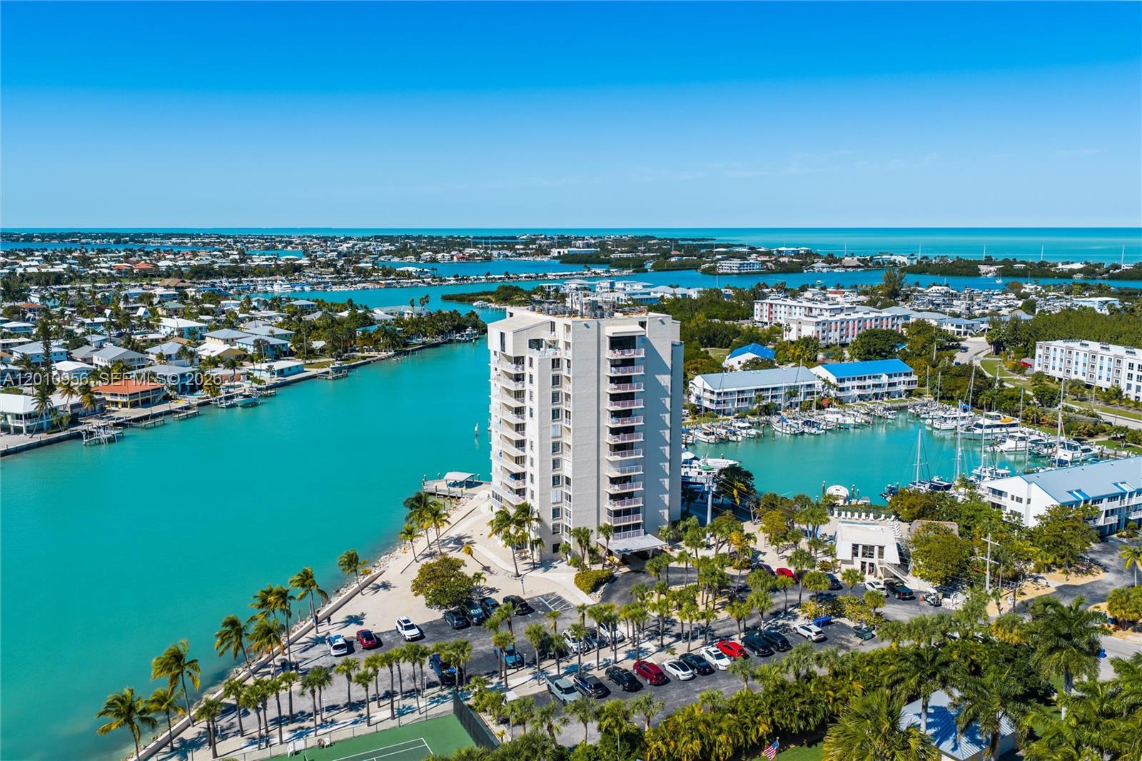 Where else can you find Oceanfront living with stunning sunrises and sunsets all for under $500k in the Florida Keys? Experience elevated coastal living in this bright and airy 1-bedroom, 1.5-bath condo at iconic Bonefish Towers, the tallest building in the Florida Keys. This unit offers breathtaking, unobstructed views of the Atlantic Ocean from both the main living area and the bedroom, where you can watch boats glide by and enjoy the rare luxury of both stunning sunrises and sunsets from the same home. Designed with an open layout and abundant natural light, the condo features two spacious walk-in closets and a seamless flow perfect for relaxing or entertaining. The property allows 28-day rentals, offering excellent income potential. Low HOA fees provide stress-free living and include building insurance, exterior maintenance, exterminating, common areas, cable, water, and sewer. Bonefish Towers delivers resort-style amenities, including tennis and pickleball courts, swimming pool, saunas, fitness center, billiards room, fishing access, onsite management, and ample parking. Whether you're seeking a full-time residence, vacation getaway, or investment opportunity, this oceanfront condo checks every box. Call Today!