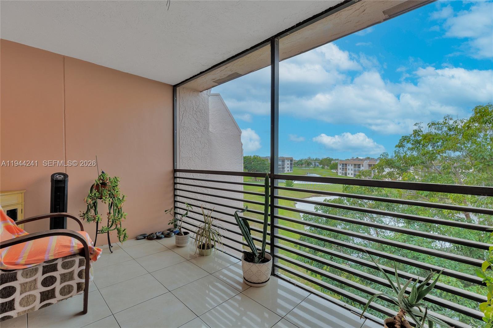 Waterfront/golf course view from your Sunrise Lakes Phase 4 Condo. Screened in room is included in this Large split 2 bedroom/2 baths close to 1400 sq feet. Owner has completely remodeled kitchen and updated bathrooms. Washer, dryer and air condition are upgraded and newer. Most of all the top floor means no one is above and the view is beautiful as well as the condo.  Just enjoy playing golf and swimming in heated pools. Complete clubhouse, shows, entertainment, heated pool, gym and much. more. Shopping, bus close by.
Elevator next to unit. Washer and Dryer has it's own room and updated. Actual  Total sq footage 1370