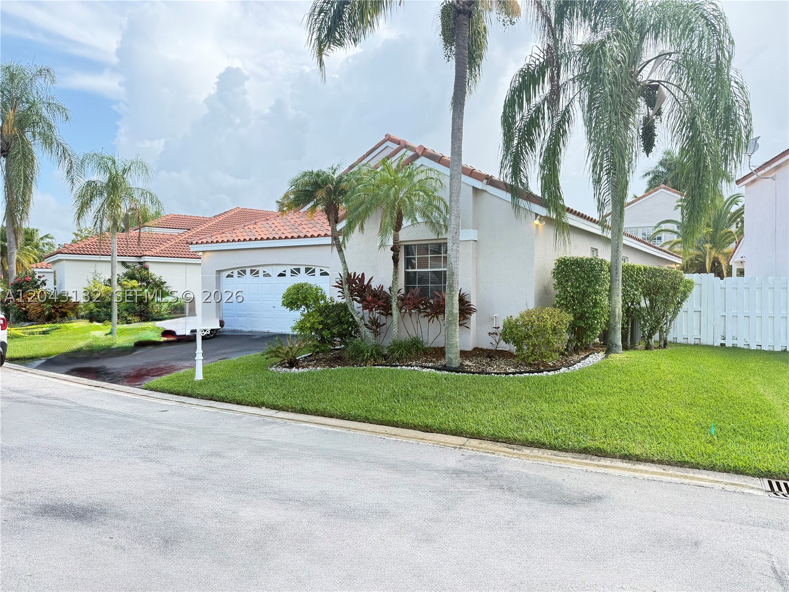 Located in the heart of Weston, Bermuda Springs is a small, well-kept gated community close to shopping centers, schools, and parks, with low HOA fees of only $410 quarterly. This move-in ready 3-bedroom, 2-bath home at 345 Somerset offers comfortable Weston living with a split floor plan, a bright open layout, tile flooring in the living areas, stainless steel appliances, a granite backsplash in the kitchen, a snack bar, and a dining area with French doors leading to the covered patio. The family room also opens through sliding doors to the fenced backyard, and the home includes a 2-car garage. The bathrooms also feature granite finishes, and the main bathroom includes a double sink, shower, and separate bathtub. Freshly painted inside and out, with a roof replaced in 2020 with Colombian tile and a new electric panel in 2026, this home offers peace of mind, comfort, and charm. The community also offers a pool and child play area.