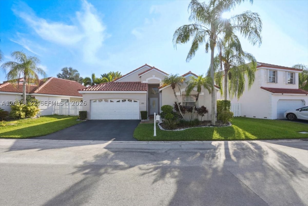 Move-in ready and beautifully maintained, this 3-bedroom, 2-bath home is located in the gated community of Bermuda Springs and offers a bright open floor plan with high ceilings, a desirable split bedroom layout, and comfortable living spaces designed for both everyday living and entertaining. The home features tile flooring throughout the main areas, wood floors in the primary bedroom, laminated floors in the two additional bedrooms, stainless steel appliances, granite finishes in the kitchen and baths, and a spacious dining area with French doors leading to a covered patio and fenced backyard. The primary bathroom includes a double sink, a separate shower and bathtub, and a linen closet for added convenience. The laundry room is located inside the house and includes a full-size washer and dryer. Additional highlights include a 2-car garage, electric charger, protective shutters, fresh interior and exterior paint, a roof replaced in 2020, and a new electric panel in 2026, offering added peace of mind and value. Residents of Bermuda Springs enjoy a well-kept community with a pool and child play area, while the home’s location in Weston provides access to highly regarded schools, nearby shopping and dining, beautiful parks, bike paths, and a strong sense of community.
