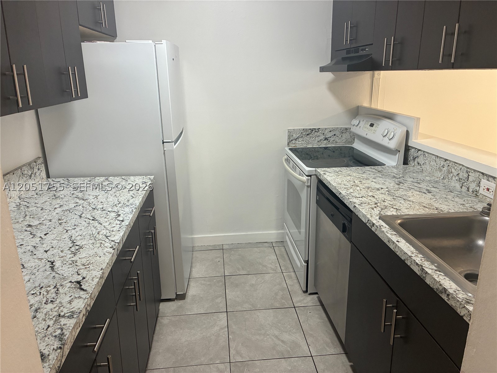 2/1.5 just crossing street to the Miami-Dade College MDC. Owner occupant Buyers and investors gem freshly painted. Enjoy a bright living area that flows into the dining space and a kitchen, the spacious bedrooms include a primary with a private half bath and a stylish full bathroom. One assigned parking and plenty guest and street parking. Relax on your private balcony and take advantage of community amenities like a pool, tennis court, play ground, laundry room on each floors and an elevator. Parking is easy with an assigned garage spot and guest parking, plus on-site laundry facilities for added convenience.