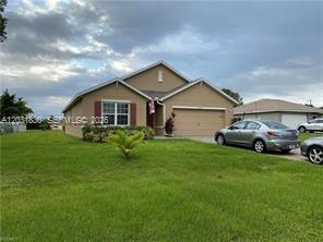 Exceptional Value in SW Cape Coral Best Price Per Square Foot! Don’t miss this incredible opportunity to own a spacious 4-bedroom, 2-bathroom home in one of Southwest Cape Coral’s most desirable locations. Built in 2018, this popular Cali floor plan offers approximately 1,828 square feet of living space, providing comfort, functionality, and modern design at an affordable price. Ideally situated near Mohawk Parkway and Chiquita Boulevard, this home offers convenient access to shopping, dining, schools, parks, and major roadways. Best of all, ALL ASSESSMENTS ARE PAID, saving you thousands and eliminating additional monthly costs. Inside, the home features 18-inch tile flooring throughout the main living areas, with carpeting in the bedrooms for added comfort. Window blinds are installed on all windows except the sliding glass doors, and the open floor plan provides an ideal layout for both everyday living and entertaining. Additional highlights include a full irrigation system, an electric garage door opener, and peace of mind knowing the property is located in a non-flood zone no flood insurance required. This well-maintained home combines value, location, and modern features, making it perfect for families, seasonal residents, or investors alike. Schedule your private showing today, opportunities like this don’t last long!