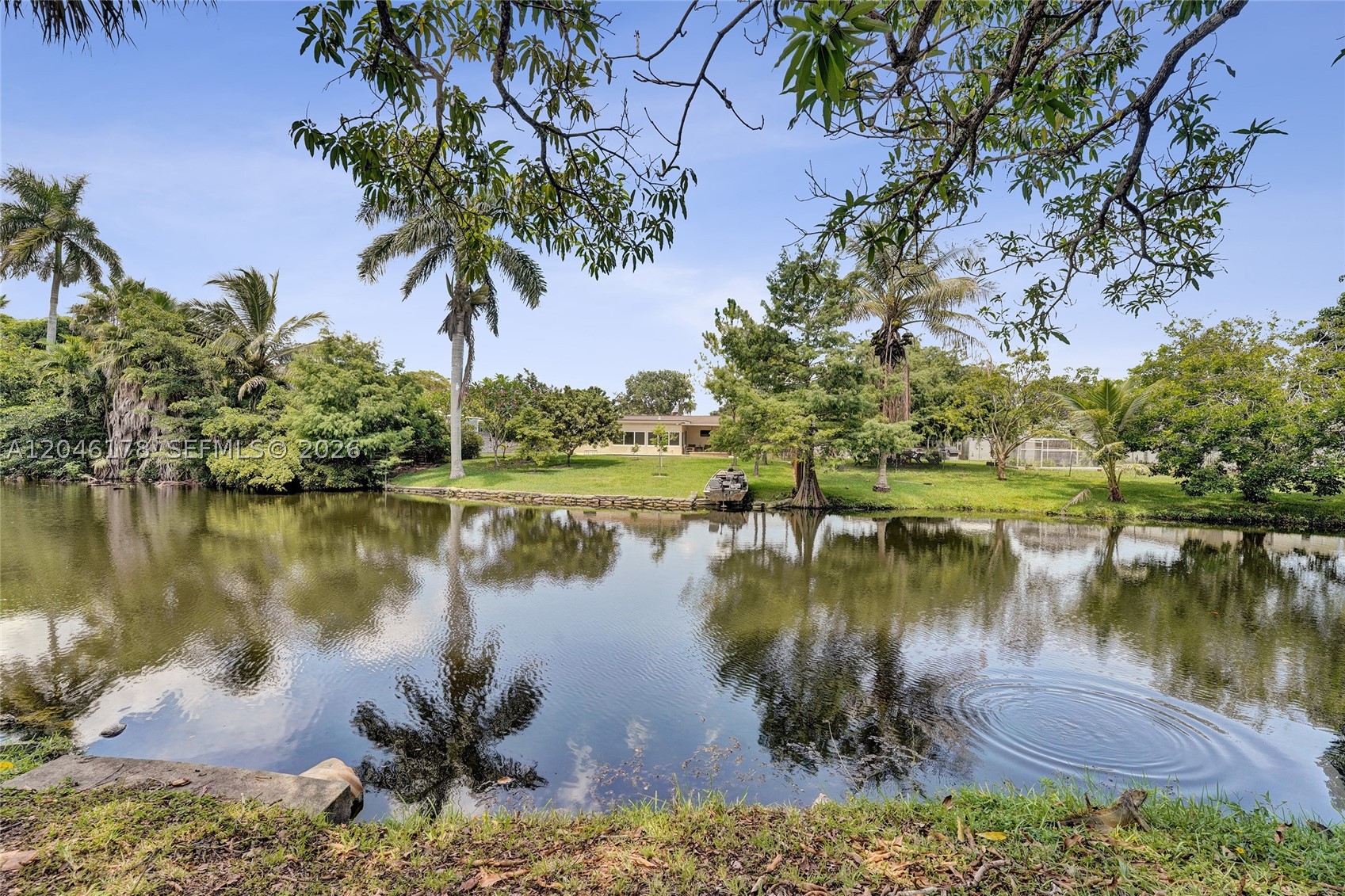 Rare opportunity to own a waterfront home in the heart of Cooper City with NO HOMEOWNERS ASSOCIATION! Proudly offered by the original owners, this 3-bedroom, 2-bathroom home is ready for its next chapter and offers endless potential to create your dream home. Featuring a spacious and versatile floor plan with vaulted ceilings, a wide-open floor plan and a step down living room that adds character and charm, this home provides the perfect canvas for your personal touches and updates.  The eat-in kitchen overlooks the living areas and tranquil water views, while the 1-car garage and full impact windows and doors provide convenience and peace of mind. Enjoy South Florida living with a community park just two homes away, offering additional space for recreation and outdoor enjoyment.  Ideally located in one of the nation's most desirable cities, this home is zoned for top-rated Cooper City schools and offers easy access to parks, shopping, dining, and major highways. Whether you're looking to renovate, modernize, or create a true showpiece, this waterfront property presents an incredible opportunity in a highly sought-after location. Don't miss your chance to make this Cooper City gem your own!