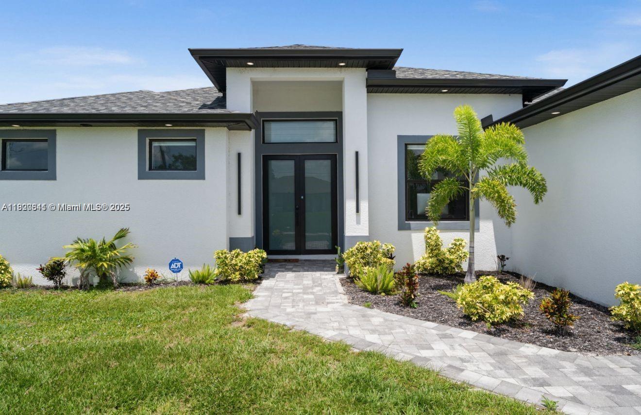 Welcome to your new home in one of Cape Coral’s most desirable and quiet neighborhoods! This 3-bedroom, 2-bathroom home offers 1,869 sq ft of comfort on a spacious 10,019 sq ft lot. Enjoy a modern kitchen with stainless steel appliances and marble countertops, a bright living room, and a master suite with private bath and walk-in closet. Outdoors, relax on the private patio, swim in the pool, or enjoy the landscaped garden. Additional features include a two-car garage, laundry room, and front yard. Close to schools, shopping, dining, and minutes from Gulf beaches!