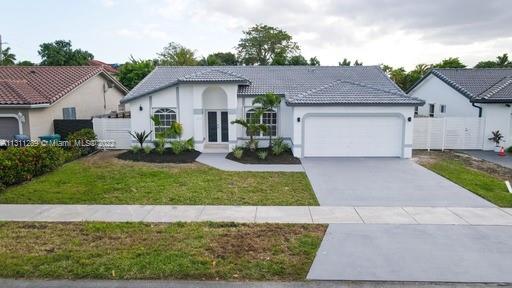 Beautiful home in Great Neighborhood.  3 BR 2 BATH W/ 2 Car Garage,  2103  TOTAL SQ FT , 1600 SQ FT LV Area. New Kitchen W/ Completely Remodeled European Shaker Kitchen  Cabinets, New Quartz Countertops and all New Stainless Steel Appliances, Completely Remodeled Bathrooms with all new Tile and Fixtures. Brand New High Efficiency A/C. High Ceilings throughout with open floor plan and tile floors. Nice sized yard W/ Covered Patio for entertaining,. Home comes with Accordion Hurricane Shutters.