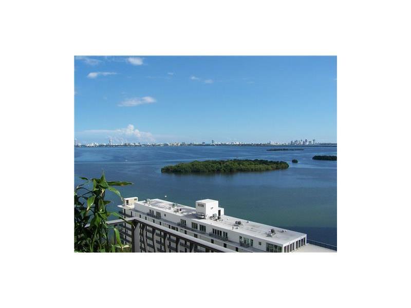 ***Spectacular bay views*** Desirable location near the Design District! In move- in condition. Remodeled kitchen and bathrooms. Offers washer and dryer in unit! Huge walk in closet. This luxury building offers: front desk with security, valet and many am enities: tennis courts, new spa, new gym, heated pool, jacuzzi, convenience store. Water and basic cable included in the rent and 2 parking spaces!!!
