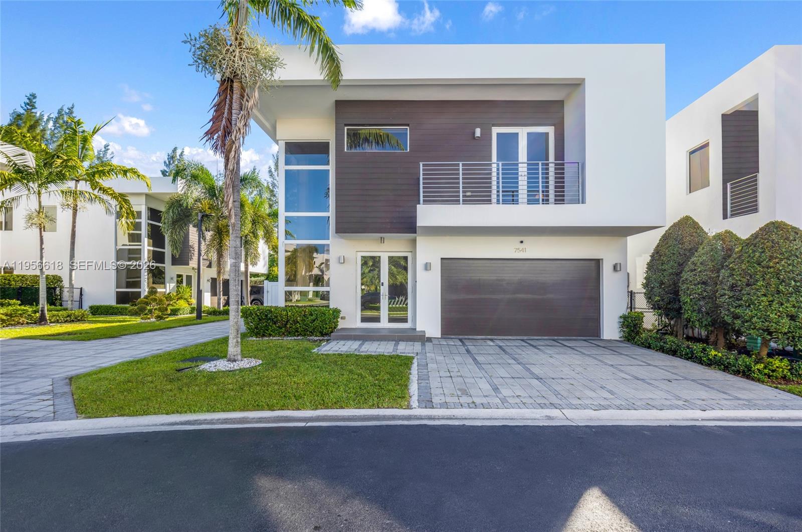 PRICE IMPROVEMENT – THE BEST VALUE IN MODERN DORAL 45.

This exceptional corner residence offers the most desirable floorplan in the community, combining expansive living spaces, soaring ceilings, and a seamless indoor-outdoor lifestyle rarely found at this price point. Perfectly positioned with no rear neighbors and tranquil views of lush greenery, the home delivers a level of privacy that is increasingly difficult to find in Doral.

Thoughtfully upgraded throughout, the property features stunning new white oak flooring, a modern glass staircase railing, custom garage cabinetry, designer laundry room built-ins with new washer and dryer, and a brand-new vinyl privacy fence. Outdoors, enjoy your own private retreat with a heated saltwater pool and fully equipped summer kitchen—ideal for entertaining year-round.

Located steps from Doral Glades Park and within close proximity to top-rated schools, this is a rare opportunity to own one of Modern Doral’s most upgraded and best-priced homes. With its premium corner lot, unmatched floorplan, extensive upgrades, and recent price improvement, this residence offers exceptional value that would be difficult to replicate today.