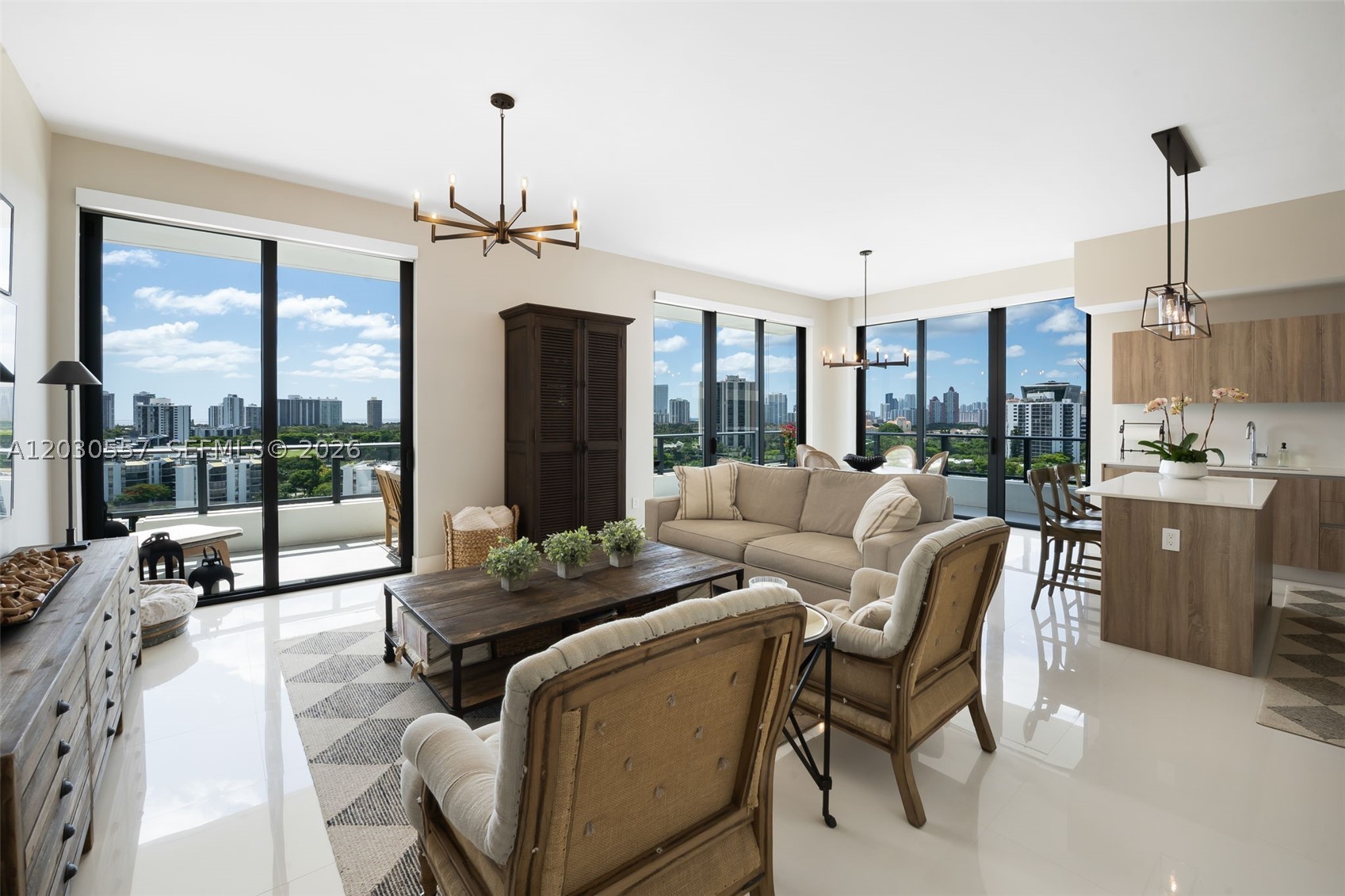 The crown jewel of Aventura Park Square, Residence 1210 is a truly one-of-a-kind penthouse offering unobstructed panoramic views spanning from Miami to Fort Lauderdale and the Atlantic Ocean. Perched high above the city, this residence boasts a vantage point unlike any other in the building. This thoughtfully designed 2-bedroom, 2.5-bathroom home features wraparound terraces that seamlessly extend the living space outdoors while showcasing breathtaking views from every room. The open-concept layout effortlessly connects the living, dining, and kitchen areas. The kitchen is appointed with sleek Italkraft cabinetry, quartz countertops, a built-in pantry, and a separate laundry room. Both spacious bedrooms feature walk-in closets and en-suite bathrooms, while a stylish powder room provides added convenience for guests. Residents enjoy a full-service lifestyle with 24-hour concierge, fitness center, and resort-style pool. Ideally located in the heart of Aventura, just minutes from Aventura Mall, premier dining, cafés, fitness studios, parks, and the beach. Penthouse residences with wraparound terraces are exceptionally rare, making Residence 1210 a unique opportunity within Aventura Park Square. Schedule your private showing today.