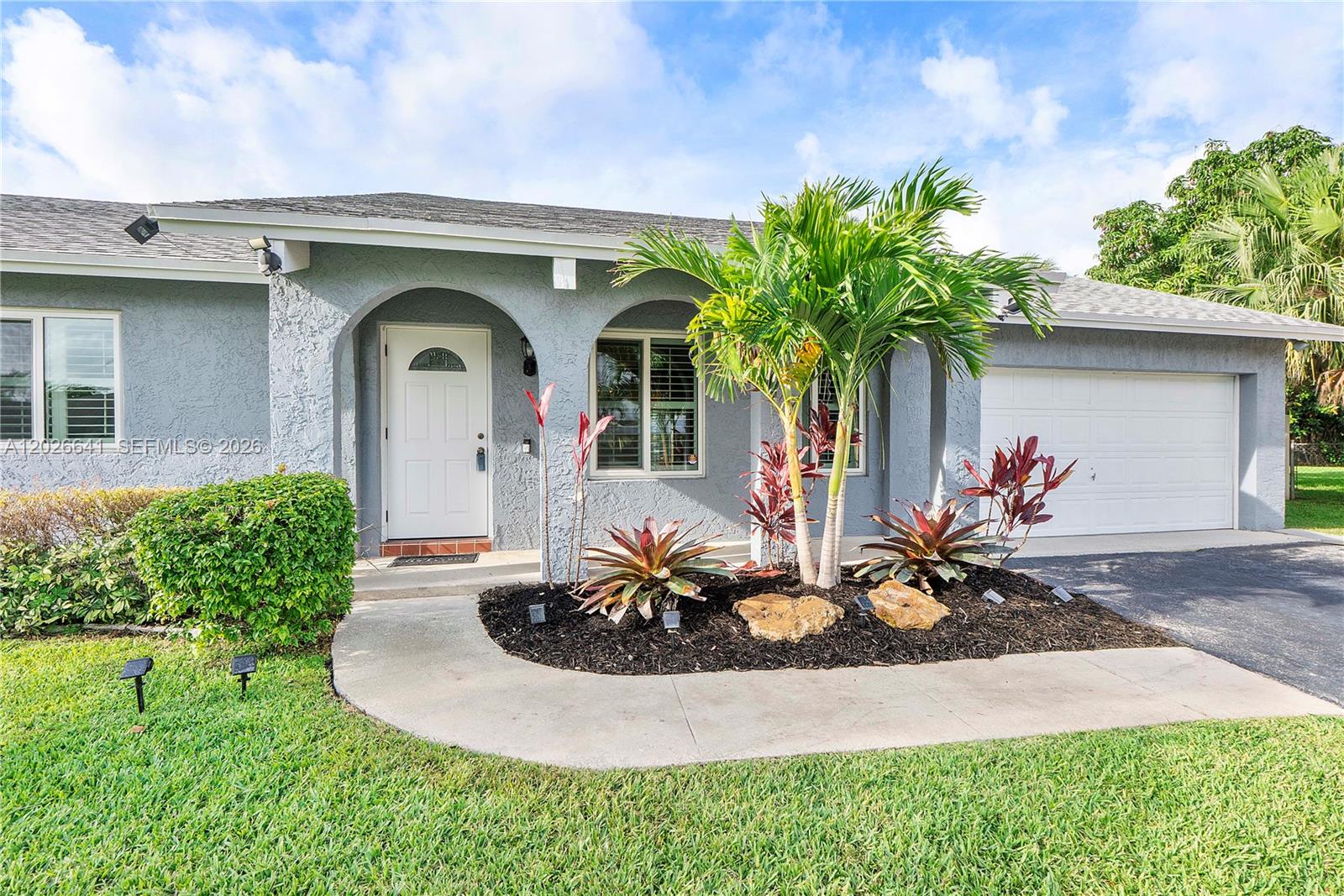 Impeccably maintained 3BR/2BA home on an oversized cul-de-sac lot with exceptional curb appeal! This move-in ready home features hurricane impact windows and doors, plantation shutters, new laminate flooring in all bedrooms and formal living room, and a beautifully remodeled primary bath. Spacious floor plan plus an oversized 2-car garage offering plenty of storage.

Major updates already completed for peace of mind: roof (2012), A/C (2020), water heater (2022), washing machine (2024), refrigerator (2025), and dryer (2025). Pride of ownership shines throughout this meticulously maintained home. Rare opportunity to own a beautifully cared-for property with privacy and space at the end of a quiet cul-de-sac!