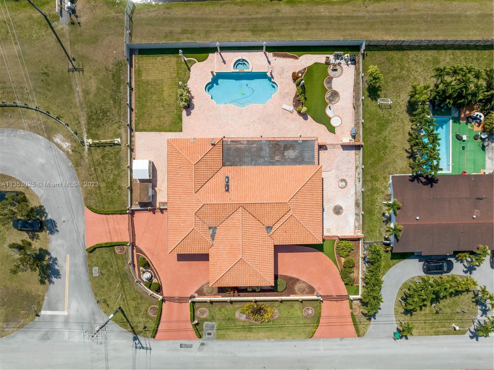 Transform this centrally located gem into your own oasis. Spacious 4500 square feet on a 18451 sqft lot with 4 bedrooms & 4 baths to cater to your every need. Picture yourself relaxing by the pool, basking in the Florida sunshine. The outdoor kitchen and paved patio provide the perfect setting for entertaining. Inside you will be greeted by terrazzo floors that add an elegant touch to the home's classic style. The wood kitchen cabinets complement the timeless design. Have ultimate peace of mind with a closed-circuit security system and gated entrance with operators. With 2 AC units, you'll stay cool and comfortable all year round.  All you have to do is bring your personal touches to transform this home into your own private haven. Don't miss the chance to own this unique property in Miami