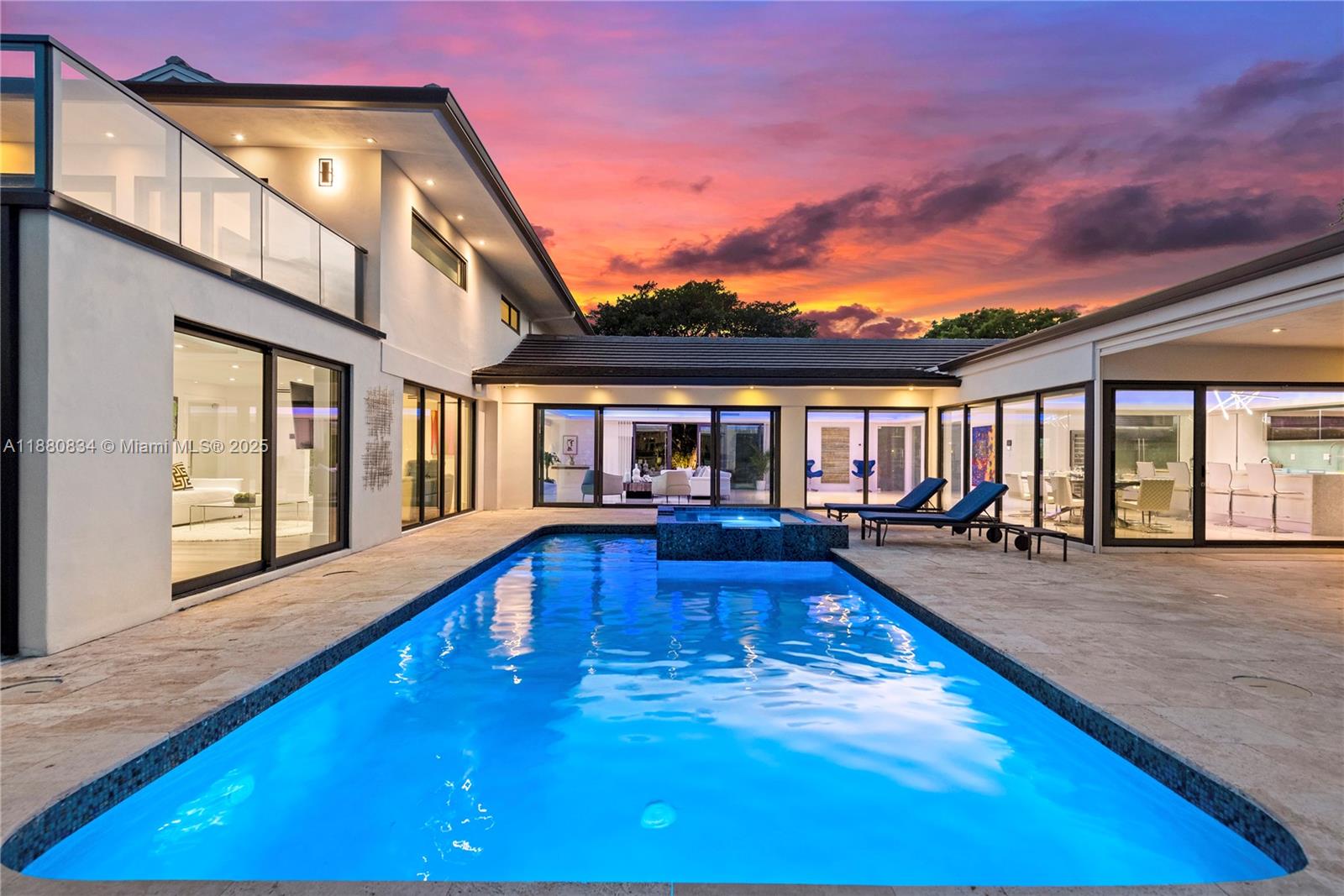 An exclusive waterfront enclave to enjoy the features of a waterfront lifestyle. This magnificent residence features a heated pool and jacuzzi that overlooks the expansive water views. An entertainer's dream with a plenty of entertaining areas. A Boater's Dream, this home has a dock, boat lift and a Jetski lift with 70 feet of water frontage. The home has been completely remodeled and is being sold furnished. This home has a legal vacation rental license and is also perfect for investors. It currently is being managed and has a revenue report that is available to registered buyers. Easy to show.