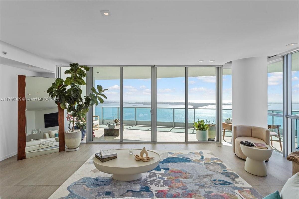 Residence 4211 at Jade Brickell: arguably the best and most highly sought-after unit line in all of Miami...and this one is a fully renovated masterpiece perched high up on the 42nd floor. Live with the permanent backdrop of where turquoise waters meet crystal blue skies...breathtaking views from every room. Your private elevator opens directly into a sprawling flow-through layout with nearly 4,300 total SF, 3 terraces for sunrise & sunset views, and southern exposure providing natural sunlight in every room. A testament to luxury living, Jade Brickell sits directly on the water, just steps from world-class dining, upscale shopping, and the vibrant Brickell energy. Indulge in 5-star amenities, including a state-of-the-art fitness center, spa, resort-style pools, valet, concierge, and more.