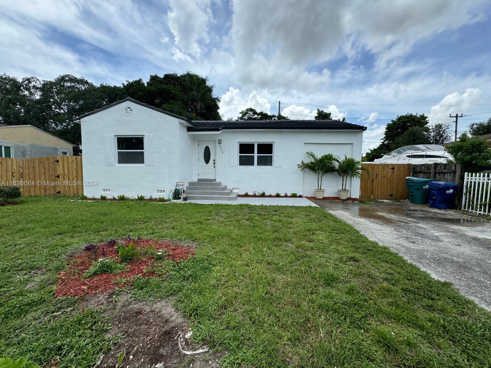 Completely remodeled 3/2 home with NEW FLAT TILE ROOF!.  New kitchen with stainless steel appliances, new bathrooms, new floors. Nice yard space with room for a pool. Plenty of parking.