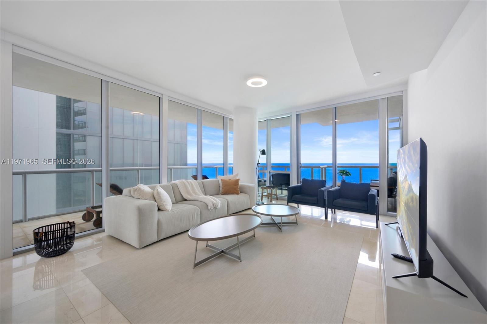 This stunning residence in Sunny Isles Beach offers 3 spacious bedrooms and 3.5 bathrooms, featuring breathtaking direct ocean views along with panoramic city vistas. Enjoy both sunrise and sunset from the generously sized balconies. The home includes an assigned covered parking space and a private storage area, complemented by resort-style amenities that elevate daily living. Residents can indulge in an infinity-edge sunrise pool, a sunset pool overlooking the Intracoastal, and a private beach club complete with café service, chaise lounges, and umbrellas. A state-of-the-art health club provides spa treatment rooms, saunas, steam rooms, and a full TechnoGym™ fitness facility. Additional lifestyle features include a private cinema/media room, a children’s playroom, a business center, and an elegant oceanfront porte-cochere entrance. The building is equipped with advanced “Smart Building” technology, allowing residents to control lighting and communicate with concierge or valet through in-home touchscreens or smartphones. Inside the unit, floor-to-ceiling windows, European cabinetry, Miele and Sub-Zero appliances, and expansive walk-in closets create an atmosphere of luxury and sophistication. Tenant occiped.24-48 hours notice required