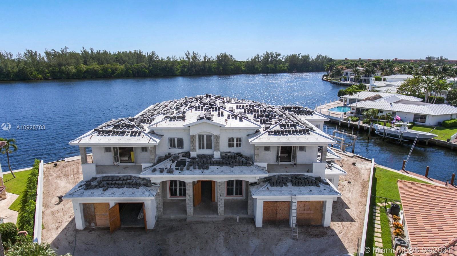 COMPLETION SPRING 2021 - This brand-new, exquisite British West Indies estate designed & built by First Water Building & Design, is located at the end of a cul-de-sac in exclusive Lake Rogers Isle and sits on a rare, oversized, point-lot with 218.96 feet of double Intracoastal frontage. Offering the finest craftsmanship, the home will contain automation by Control-4, full home generator, wood-engineered flooring, custom porcelain bathrooms, chef's kitchen w/ sub-Zero & Wolf appliances, 2 laundry rooms & an elevator. The highest quality of materials have been used to complete the home such as Kolbe impact windows and doors. A tropical oasis outdoors, the infinity pool rests amongst hand-picked lush landscaping overlooking the Intracoastal waterway.