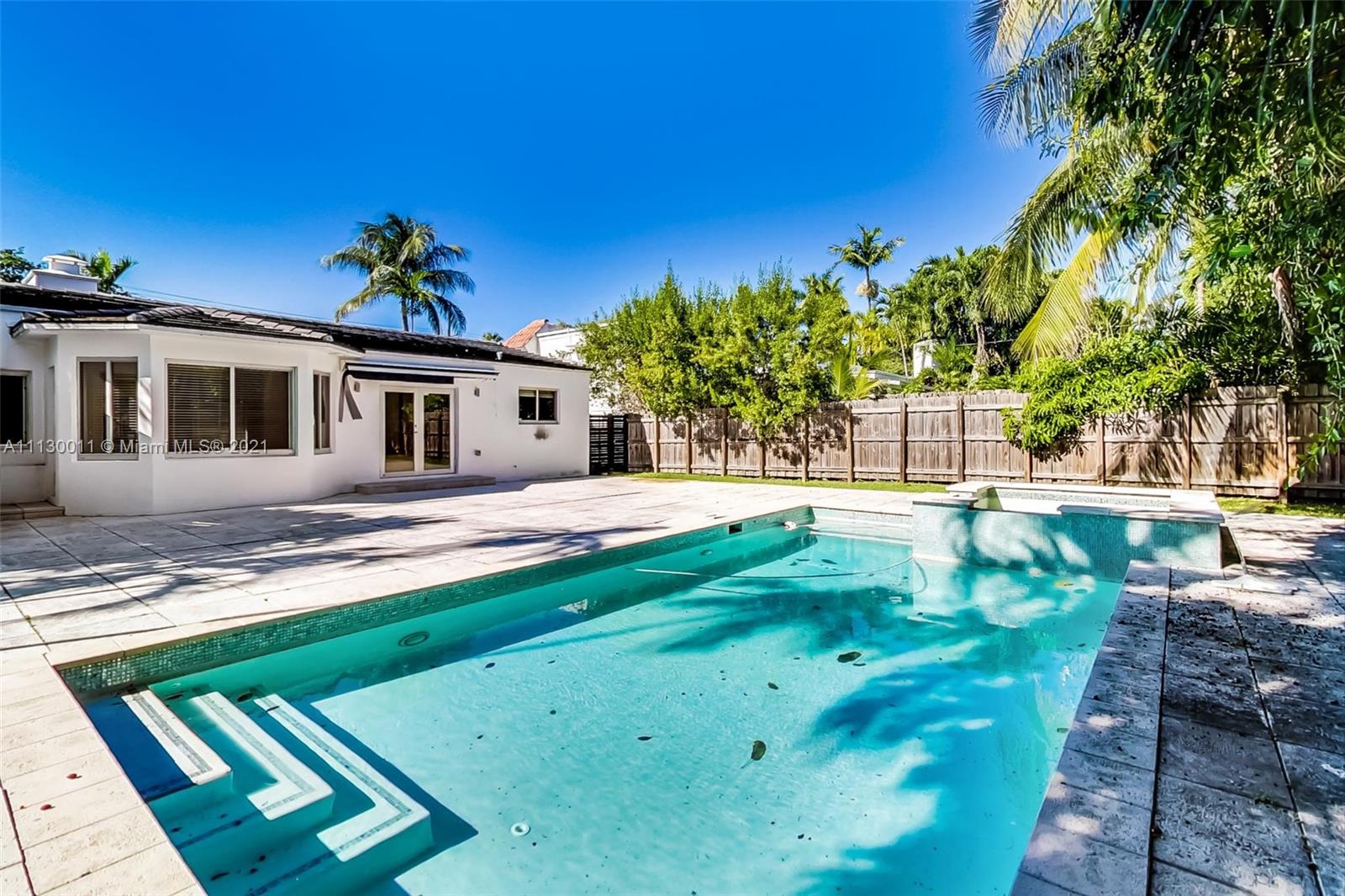 Mid Century Modern home located in Mid Beach is ready for move-in right away. Enjoy living in this newly renovated 3 BD | 3 BA home with open floor plan and abundant natural light that fills the home. Impact windows throughout the home. Access your backyard through double door where your pool awaits as swimming is available all year round. Single story home makes it easy to access each room and comes with an extra den to be converted into an office to work from home. Experience the neighborhood as it's minutes away from La Gorce Country Club, beach, and restaurants with easy access to major highway and medical centers. Whether you're relocating to Miami or need a temporary home before you decide to purchase, this home is a great introduction to the Miami lifestyle.