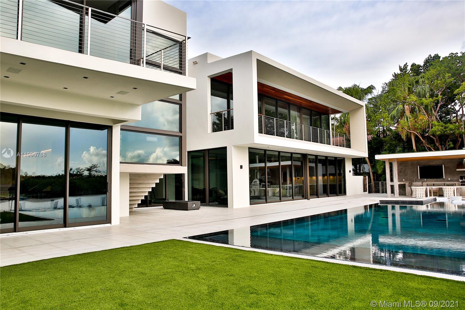Casa Costanera was designed and built by MV Group USA, the most prestigious ultra-luxury custom home builders in Florida. This 2 story residence of 7,300 square feet holds captivating water views and creates a modern yet warm feel to the home combining elements such as exposed concrete and ipe wood. With 130 feet of waterfrontage, a 70 foot dock, an entire pool deck lifted 14 ft off the ground with an infinity edge pool, custom furniture by B&B Italia, a glass elevator, and a 500 bottle wine cellar this home is strikingly irresistible to keep your eyes off of. For more info visit www.mvgroupusa.com