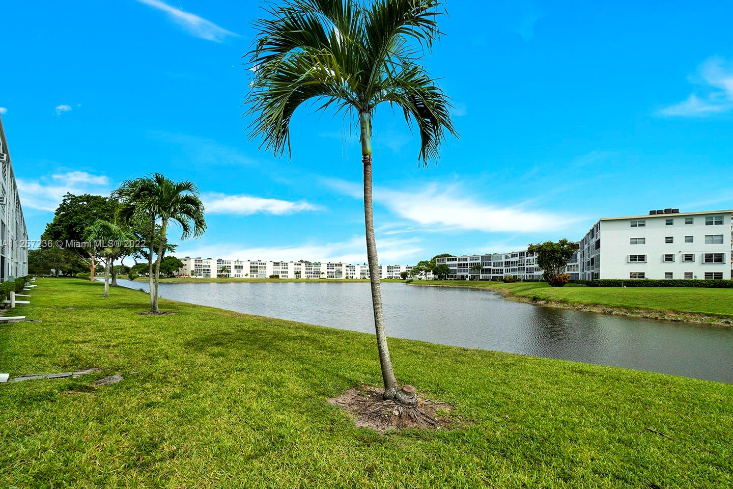 Cozy 2/1.5 in active community! Property features updated baths, wood and tile floors, peaceful water view from screened balcony and so much more. Make this your home today!