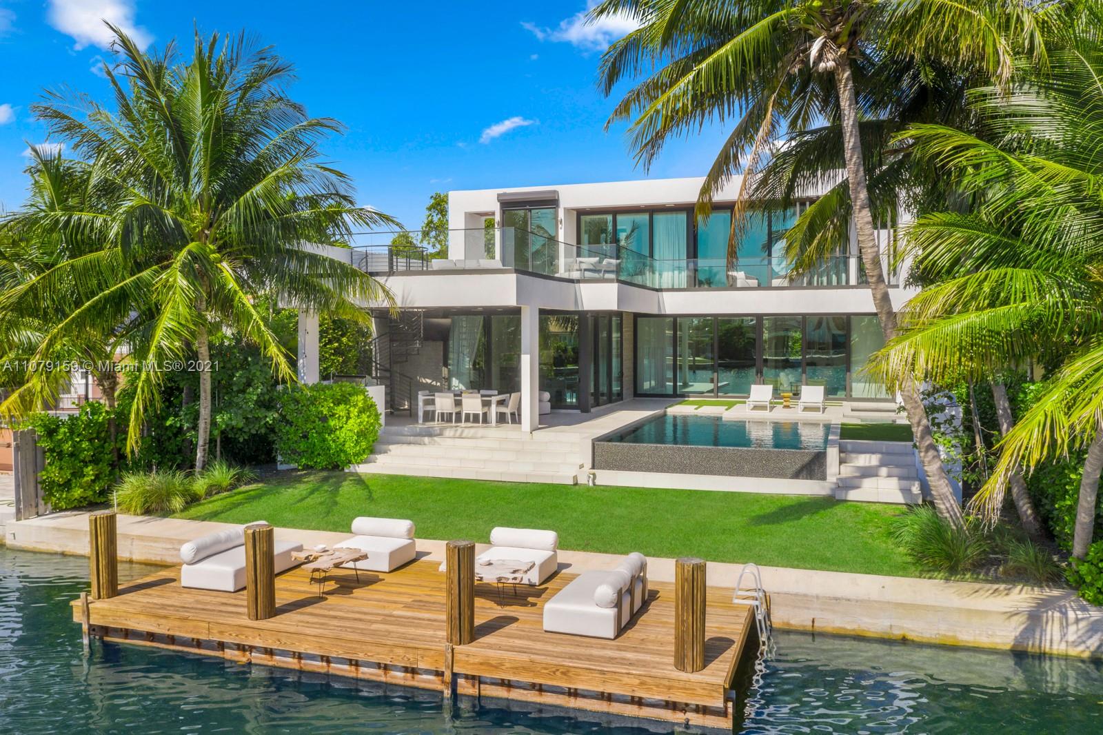 Discover 1413 Biscaya Drive in Biscaya Island - an indoor outdoor waterfront haven with six bedrooms with en-suite bathrooms steps to the Bal Harbour Shops, Indian Creek and the Four Seasons Surf Club with architecture by Choeff Levy Fischman and interiors by Vesta. Floor to ceiling impact glass & soaring 12-24 ft ceilings bring in abundant natural light. Enjoy open living areas, Private Elevator, Custom kitchen w/double wide island, endless storage, Wolf & Subzero. The perfect home for indoor & outdoor entertaining w/oversized roof top terrace & sun deck, outdoor summer kitchen, midnight bar, infinity edge pool, Jacuzzi & 68 ft on the water w/boat dock. An ideal family retreat in this secluded, private neighborhood near the best schools!