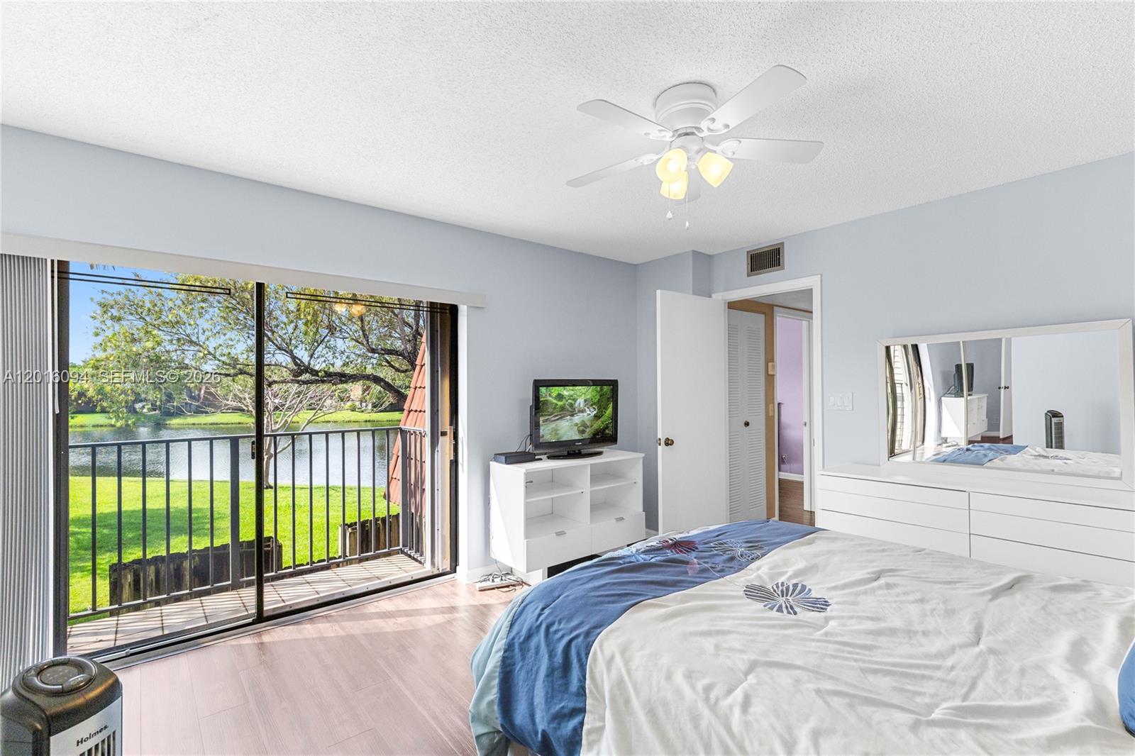 Welcome home to this charming corner-unit townhome offers a rare blend of nature, comfort, and convenience, with beautiful water views and a quiet setting that feels tucked away while still being close to everything. Located in the desirable Jacaranda/Central Park area, this 2-bedroom, 2.5-bath townhome offers the feel of a single-family home with two assigned parking spaces, a spacious private patio overlooking the lake, and balconies off both bedrooms where you can take in the tranquil scenery.

The first floor features tile & carpet flooring, a full-size washer and dryer, ample indoor and outdoor storage, and a layout ready for your personal touch. Roof replaced in 2020 and accordion shutters throughout provide added peace of mind. 

The outdoor space is perfect for relaxing, entertaining, or enjoying quiet mornings with your coffee while overlooking the water. Located just minutes from shopping, dining, entertainment, Sawgrass Mills Mall, Las Olas, downtown Fort Lauderdale, the airport, and beautiful beaches, this home offers both convenience and a serene lifestyle.
Jacaranda Central Park is nearby with amenities such as heated pools, whirlpool spa, pickleball and tennis courts, indoor racquetball, shuffleboard, clubhouse, scheduled transportation, and organized activities. Schedule your showing today!