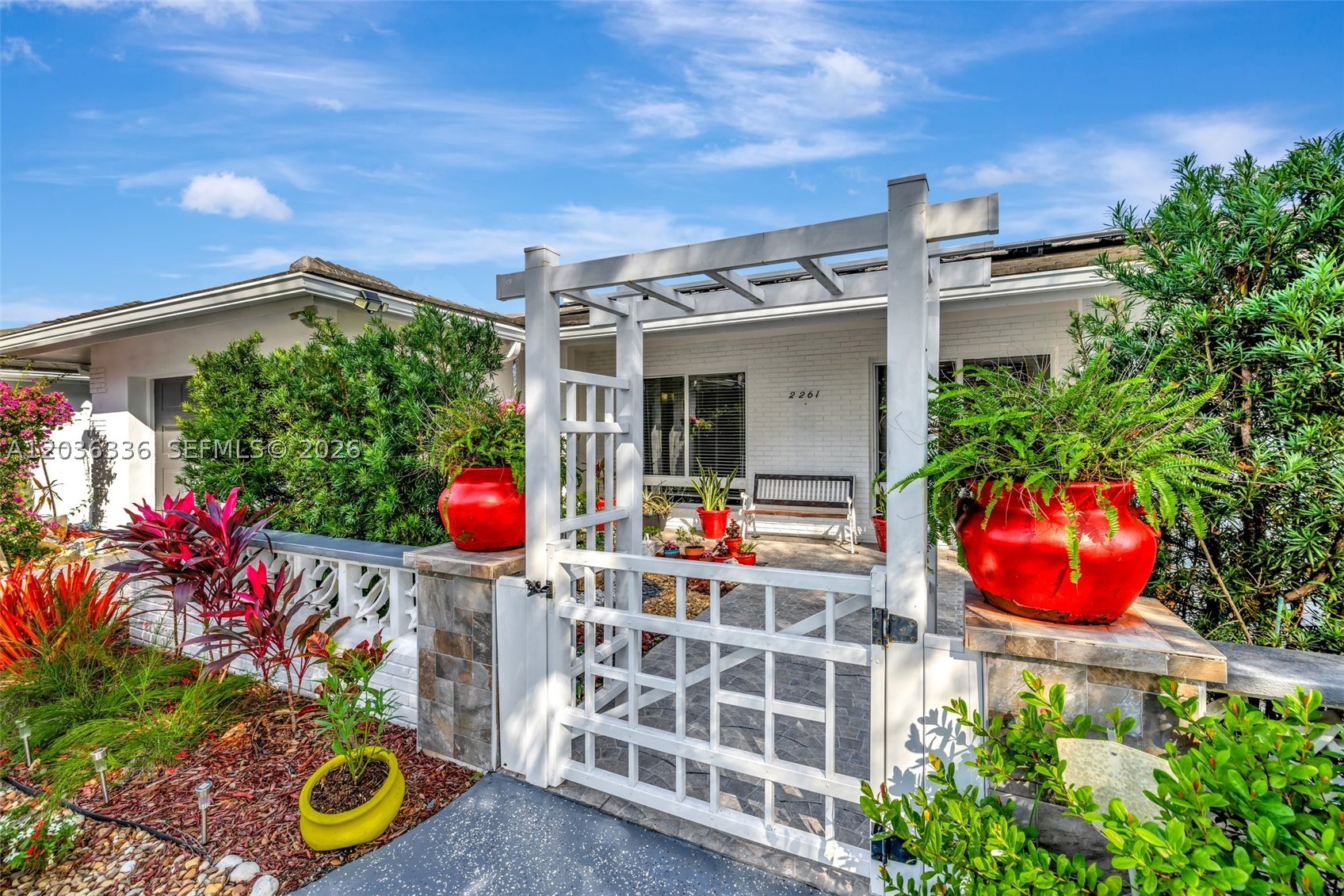 Enjoy beautiful home in the desired neighborhood of Imperial Point. Enjoy the natural oasis as you walk into this home with three bedrooms and three full bathroom home; interior includes porcelain tile throughout living areas, white cabinetry kitchen with expansive quartz countertop for entertaining, spacious dining and separate living areas. Exterior features sleek flat tile roof with energy efficiency solar panels, impact windows and doors, oversized fenced in backyard with custom grill and two entertaining outdoor areas, one car garage. Just a stroll to the beaches of Lauderdale By The Sea and Pompano Pier, convenient access to major roads and highways and just minutes to all the activities downtown Ft. Lauderdale has to offer.